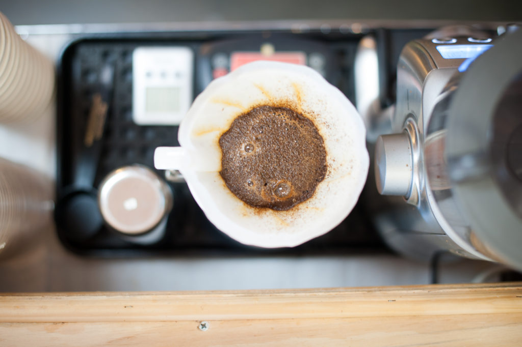 A picture of coffee brewing in a pourover at FosterHobbs Coffee Roasters in High Point, NC.