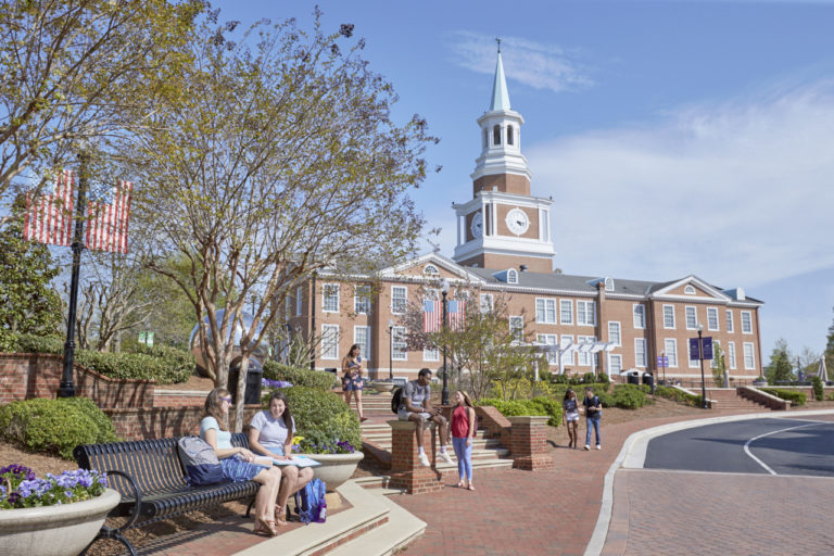 A photo of HPU students by Roberts Hall