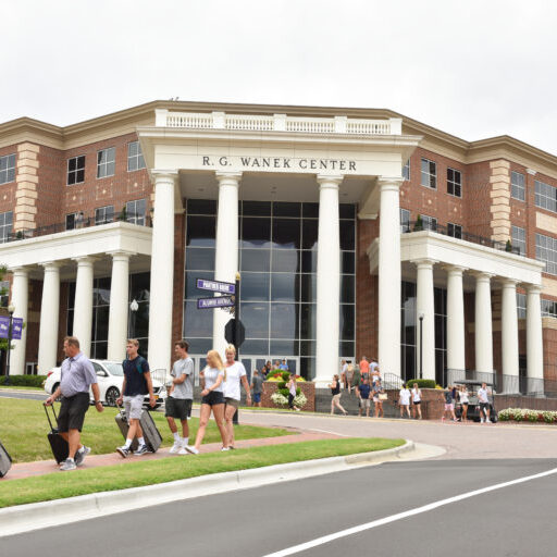 Feature image of people walking in front of the Wanek Center at High Point University