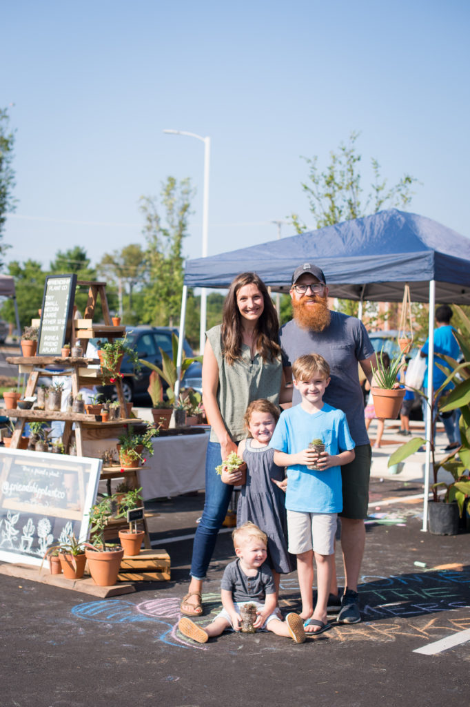 The Blackerby family stands in front of their booth at the High Point Farmer Market 