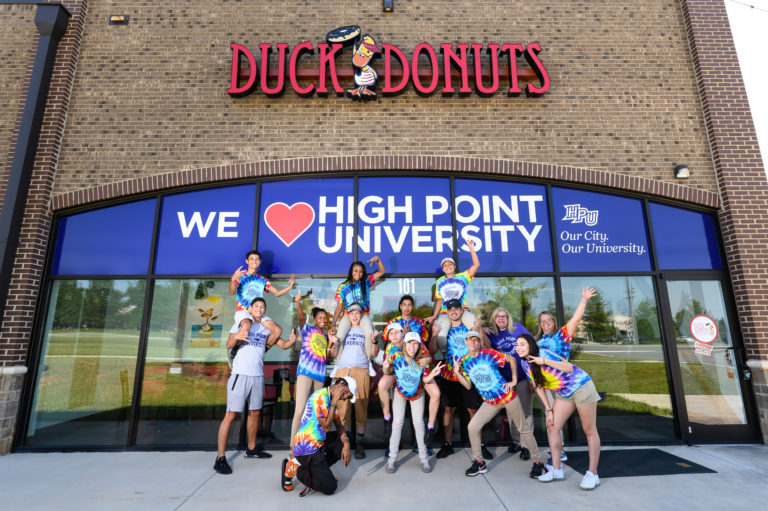 The team at Duck Doughnuts stands for a photo 