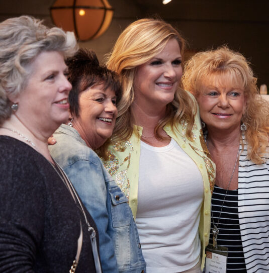 Feature image of Country music star Trisha Yearwood poses for a photo with High Point Market attendees.