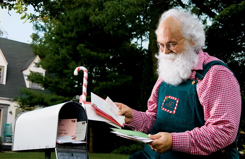 Cliff Snyder, High Point, NC's world-famous Santa Claus checks letters to the North Pole.