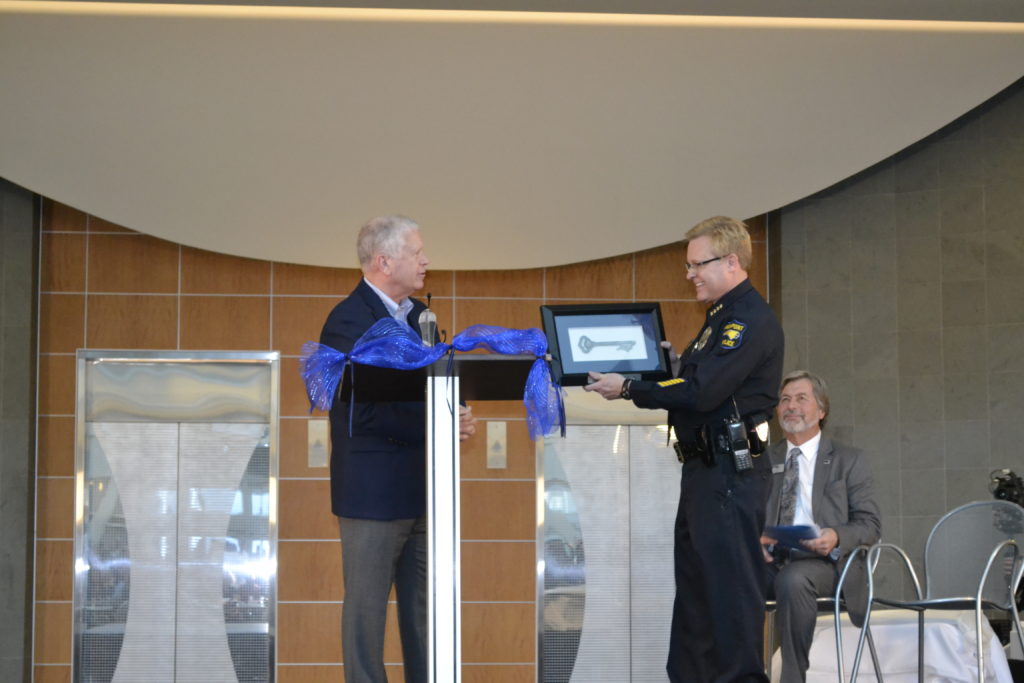 Mayor Bill Bencini hands Police Chief Marty Sumner a Key to the City of High Point.