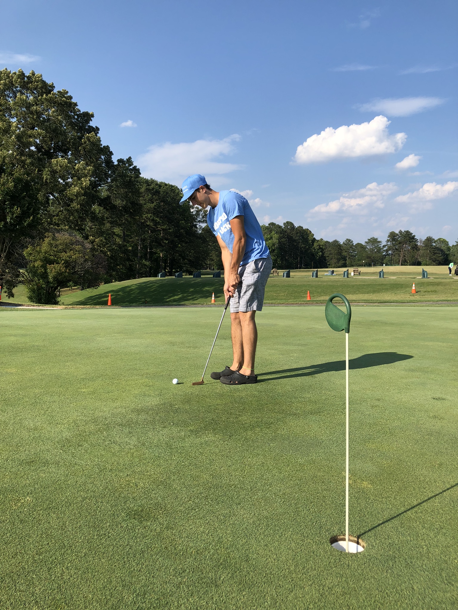 Golfer puts a golf ball on the Oak Hollow Golf Course.
