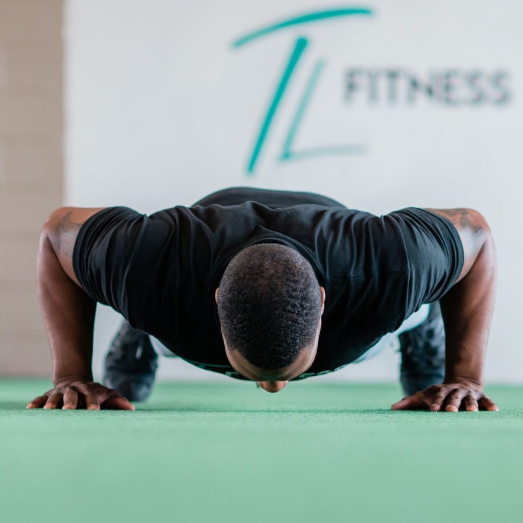 Torrey Lowe, Owner of TL Fitness, does a push up in his Gym in High Point, NC