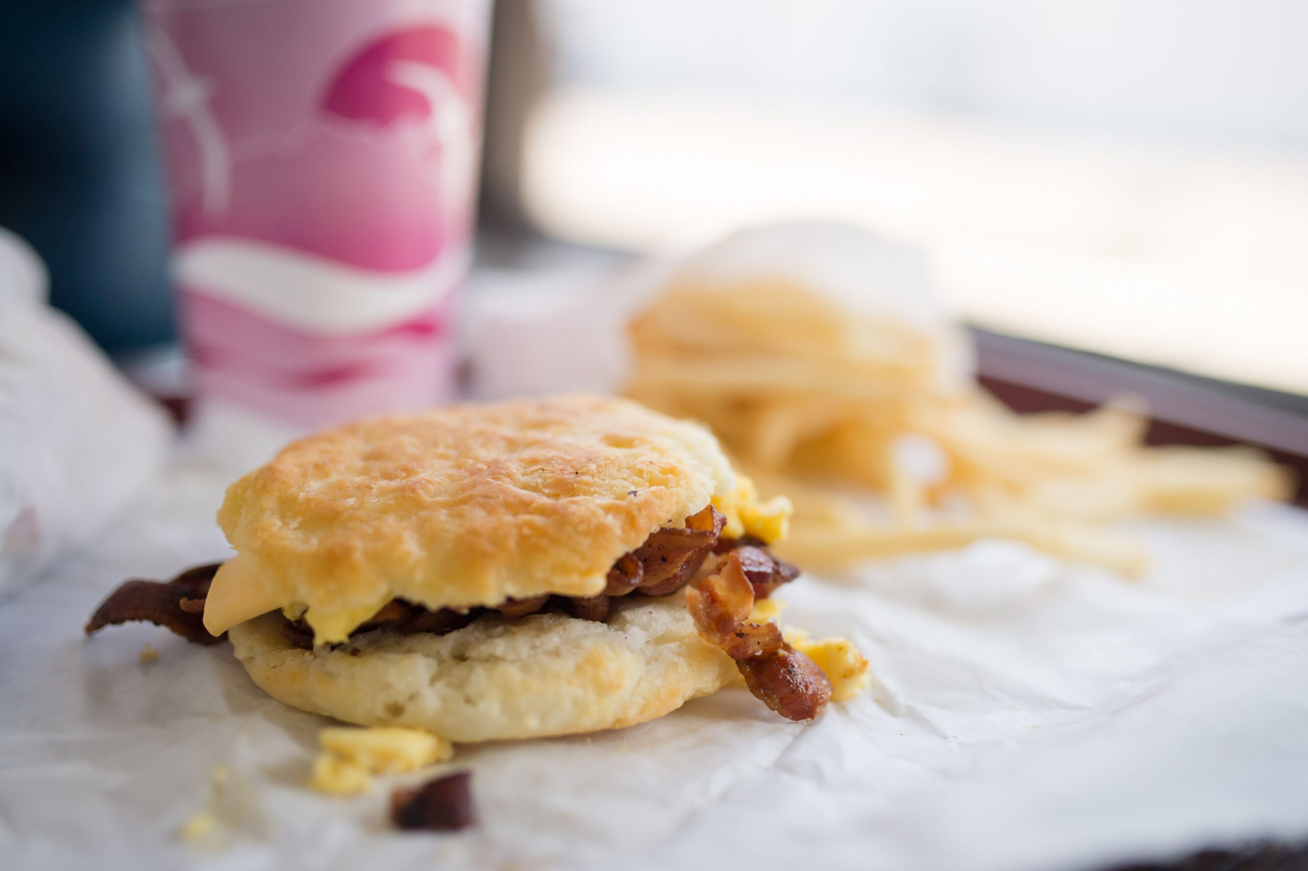A biscuit with egg and bacon sits on a wrapper at Biscuit Factory in High Point, NC.