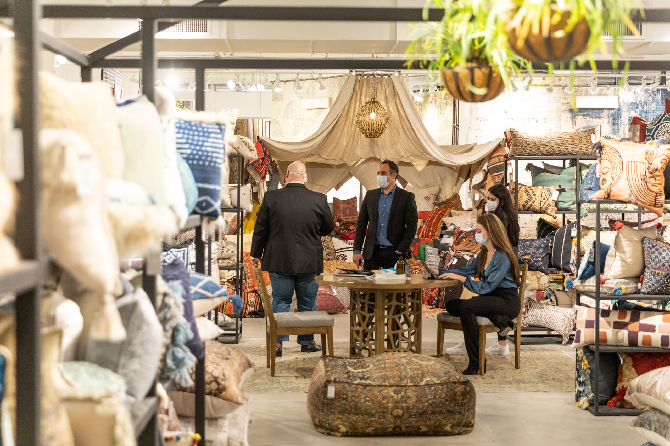 A group of shoppers shop at furniture showrooms in High Point, NC for High Point Market.