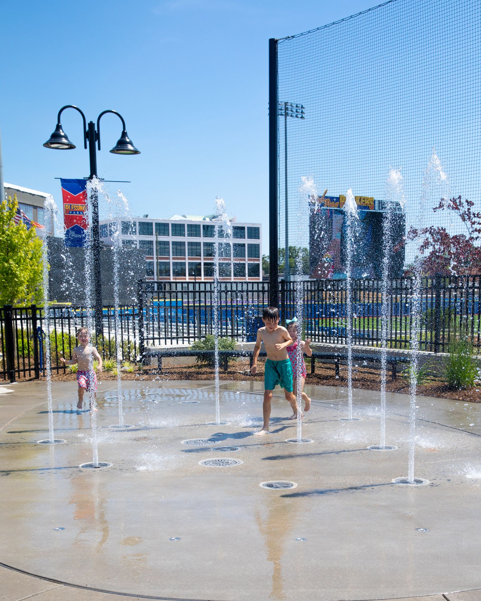 At Blessing Park in High Point, NC, kids play in the splash pad at the High Point Rockers stadium.