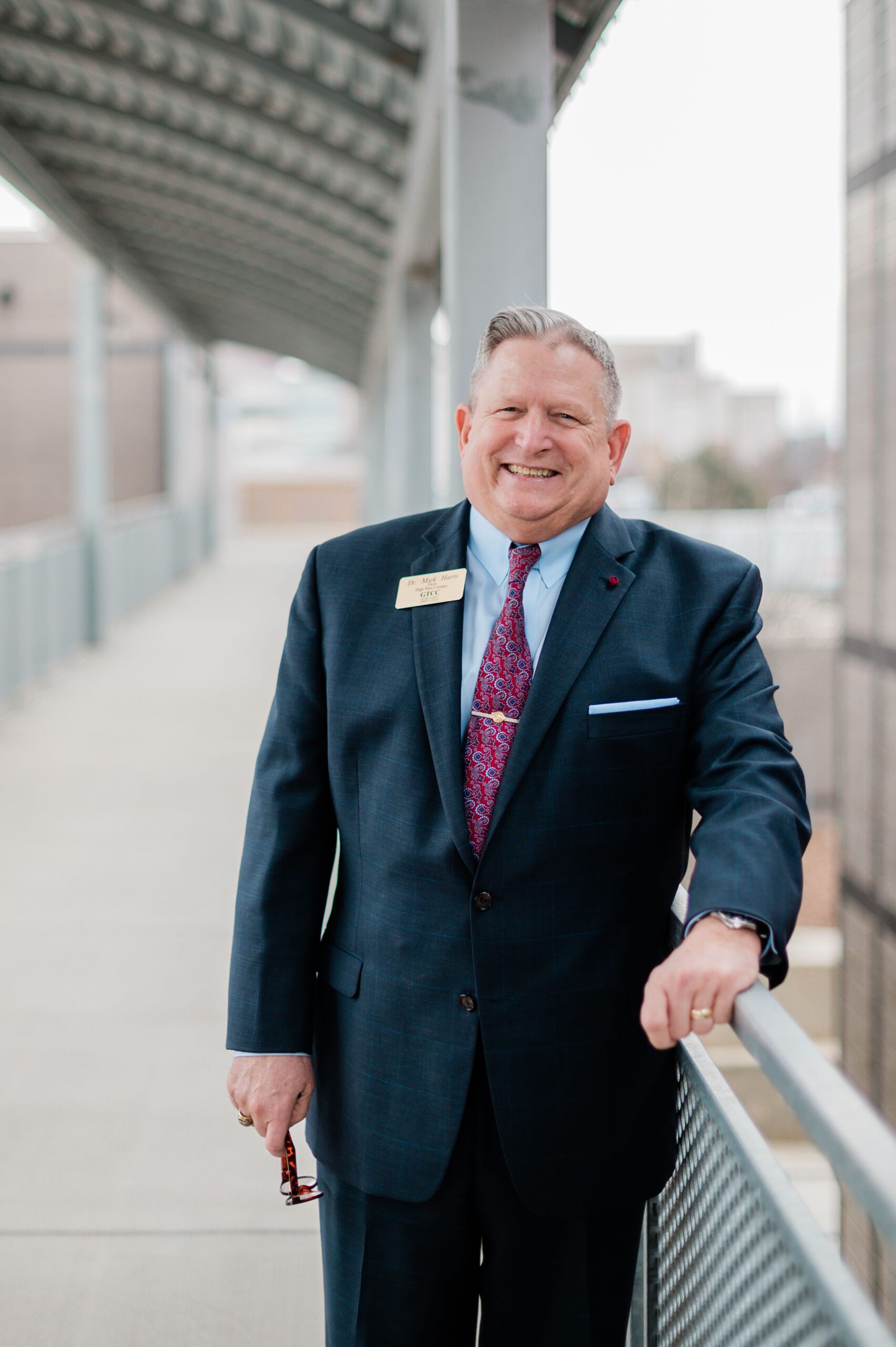 Dr. Mark Harris, Dean at Guilford Technical Community College, High Point campus, stands on the walkway in High Point, NC.