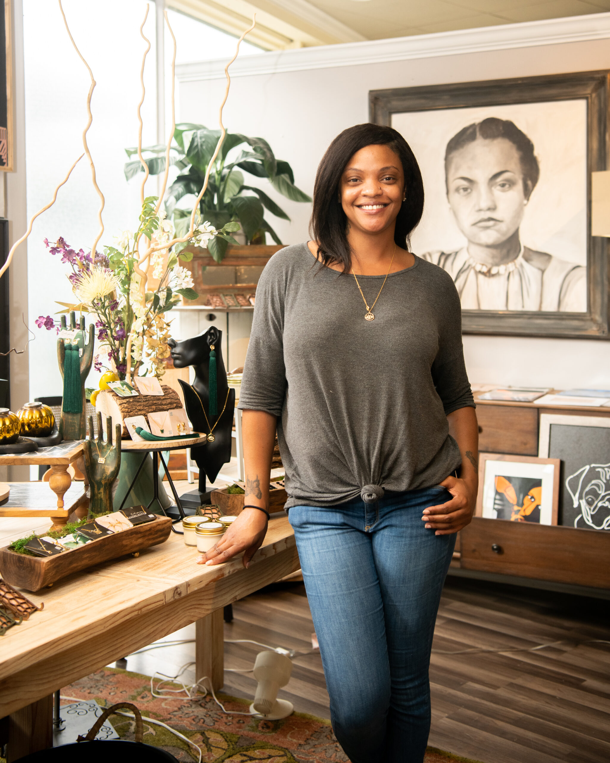 Sheena Dawkins, owner of Rhenovations, stands in her shop at the Gallery on Main in High Point, NC.
