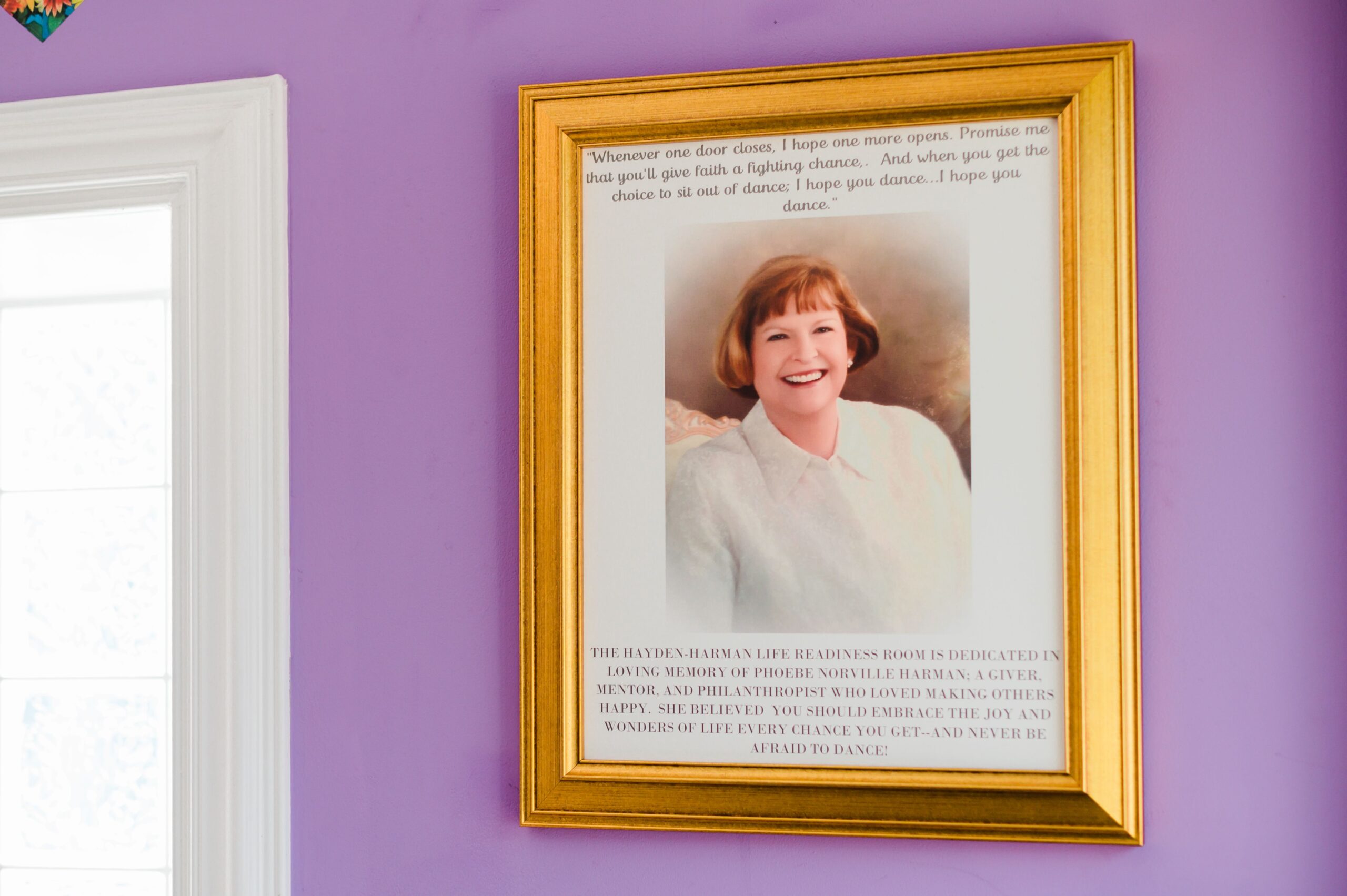 A photo frame at D-UP dedicating the room to Phoebe Norville Harman, a giver, mentor, and philanthropist in the High Point, NC community.
