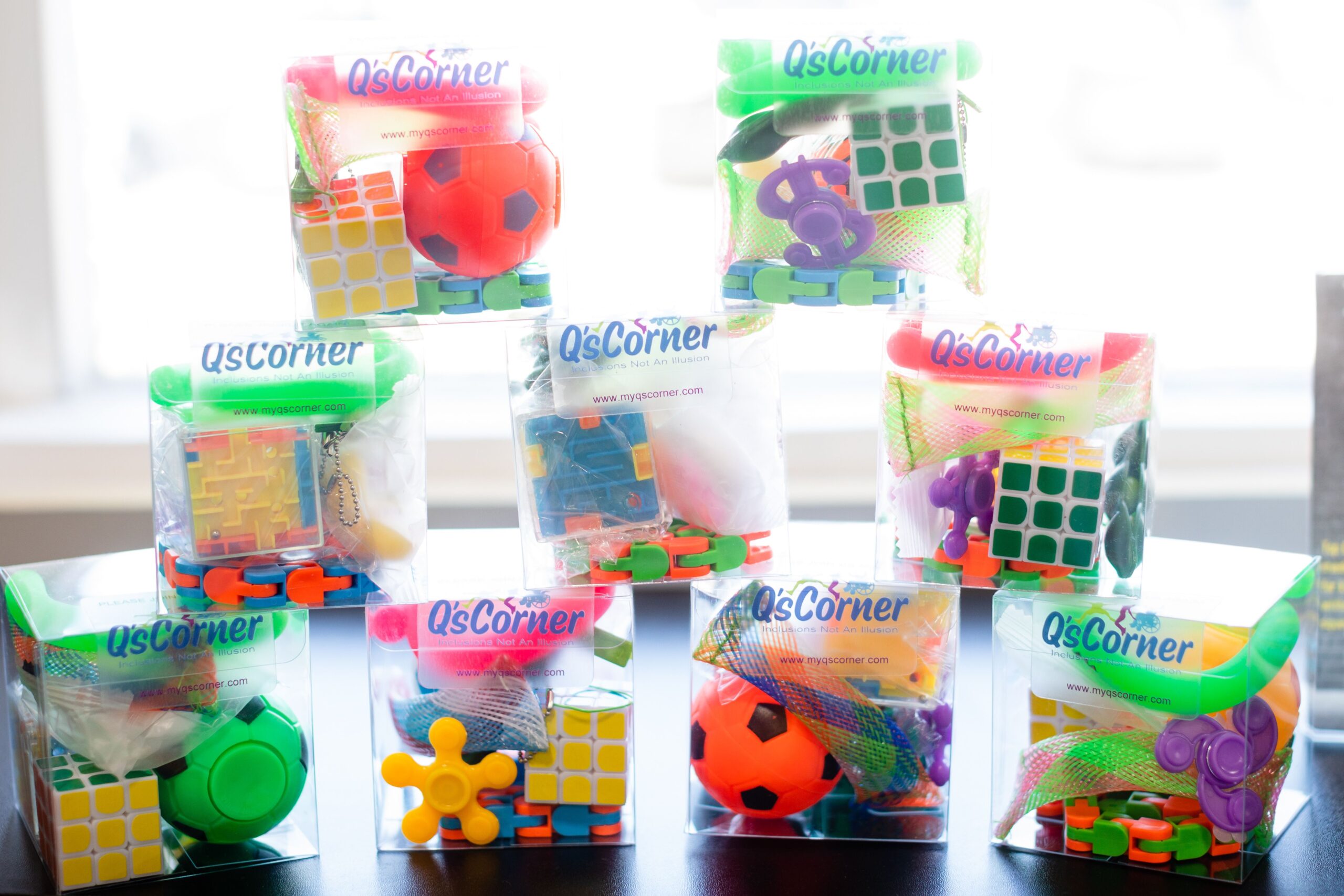 Little bags of games and activities sit on a counter at Q's Corner.