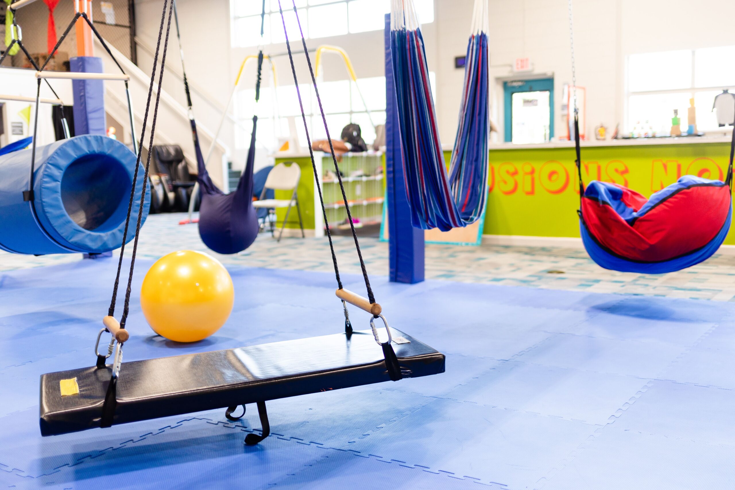 In the middle of the Q's Corner gym is a wide variety of swings for kids to enjoy.