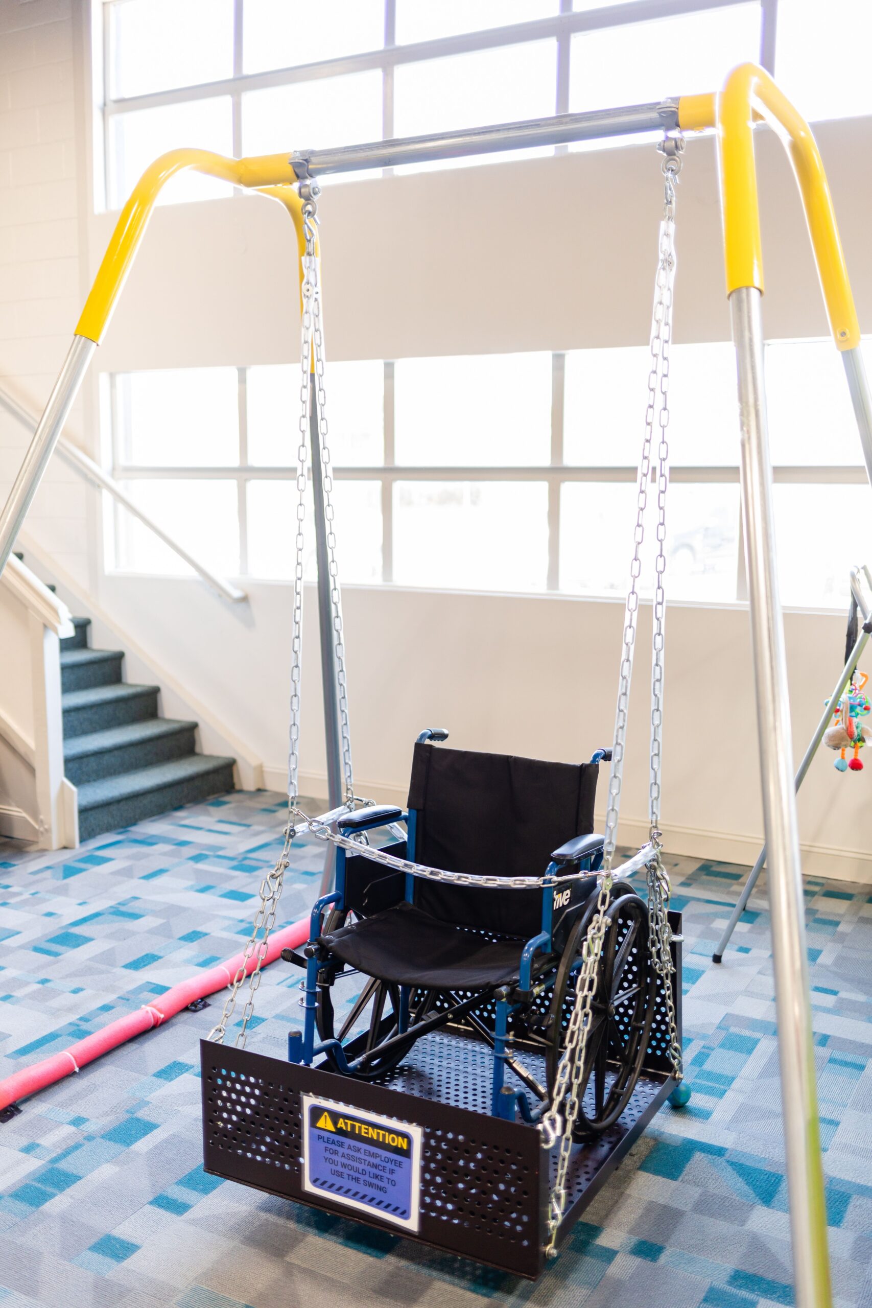 A swing with a wheelchair attachment is stationed at Q's Corner in High Point, NC.