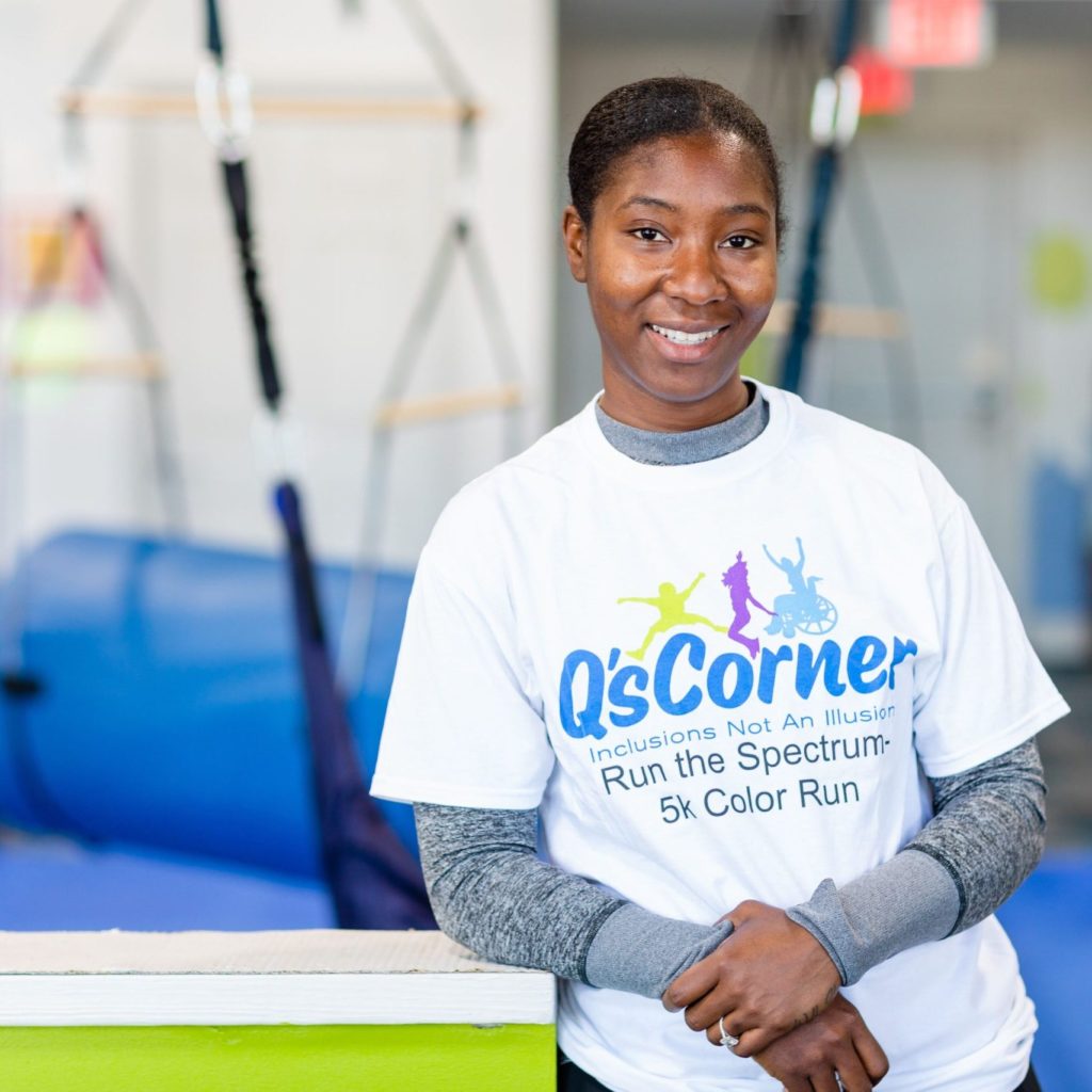 Candace Humphrey, owner of Q's Corner smiles at the camera inside the play gym in High Point, NC.