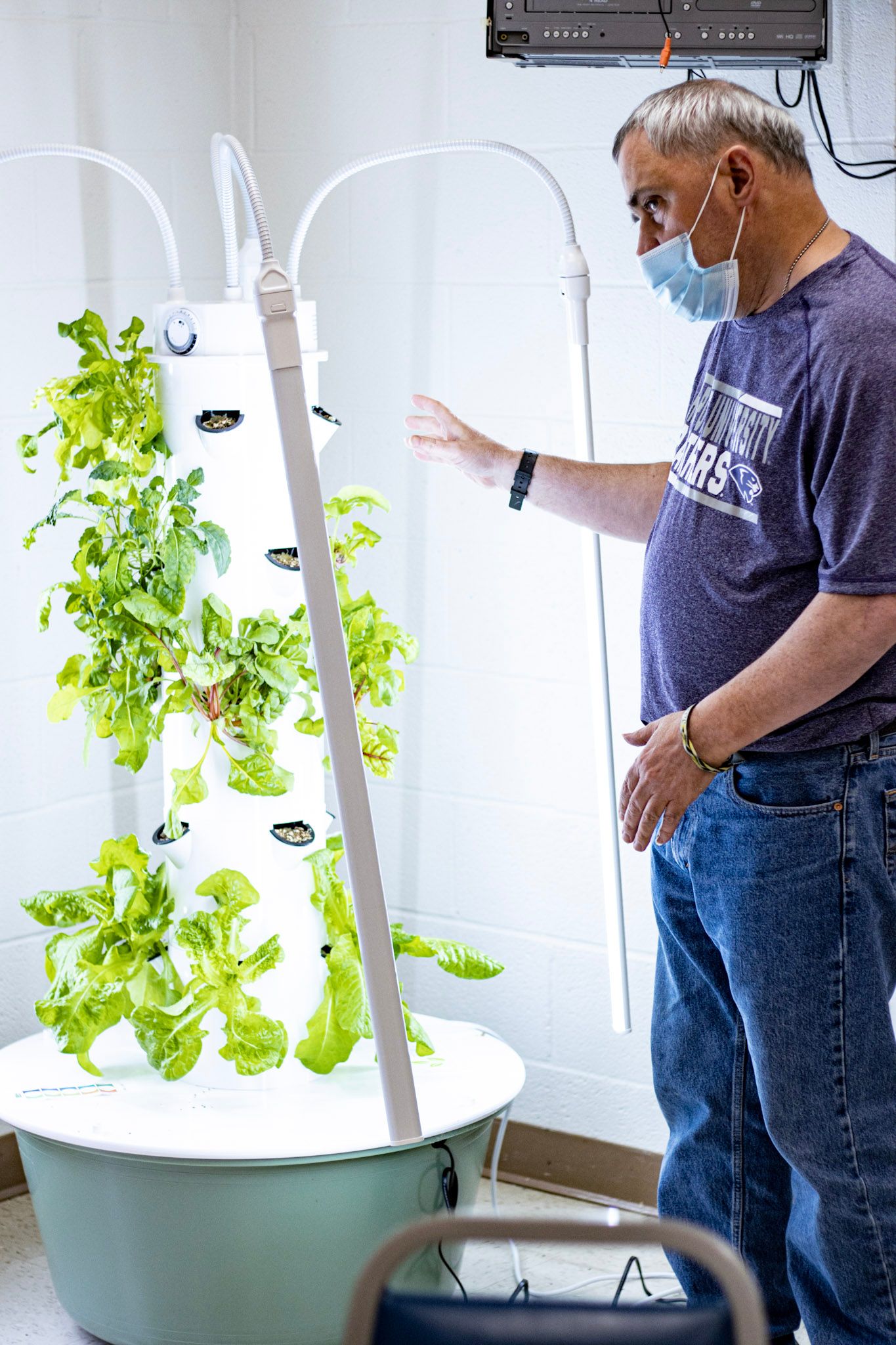 Wild and Free participant John shows off the indoor Tower Garden.