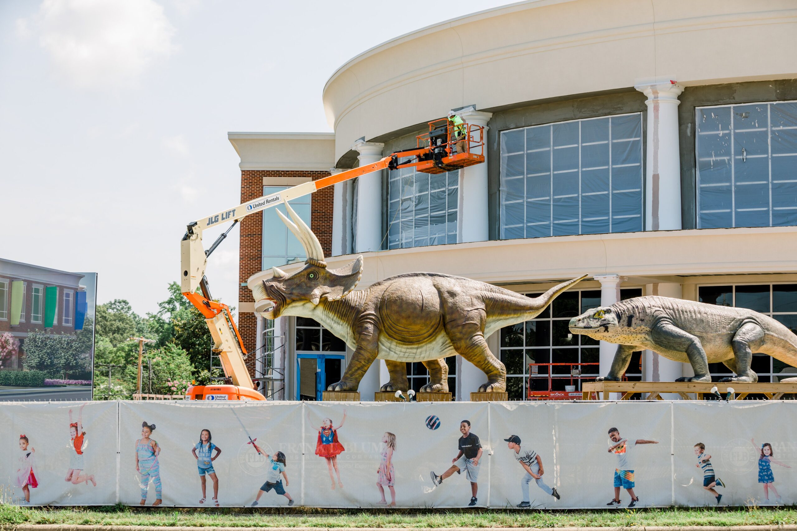 The exterior of the Nido & Mariana Qubein Children's Museum in High Point, NC, with construction happening around it.