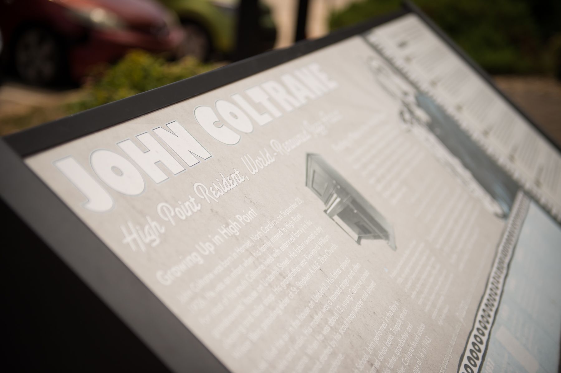 A monument describing the impact of High Point, NC on John Coltrane's childhood.