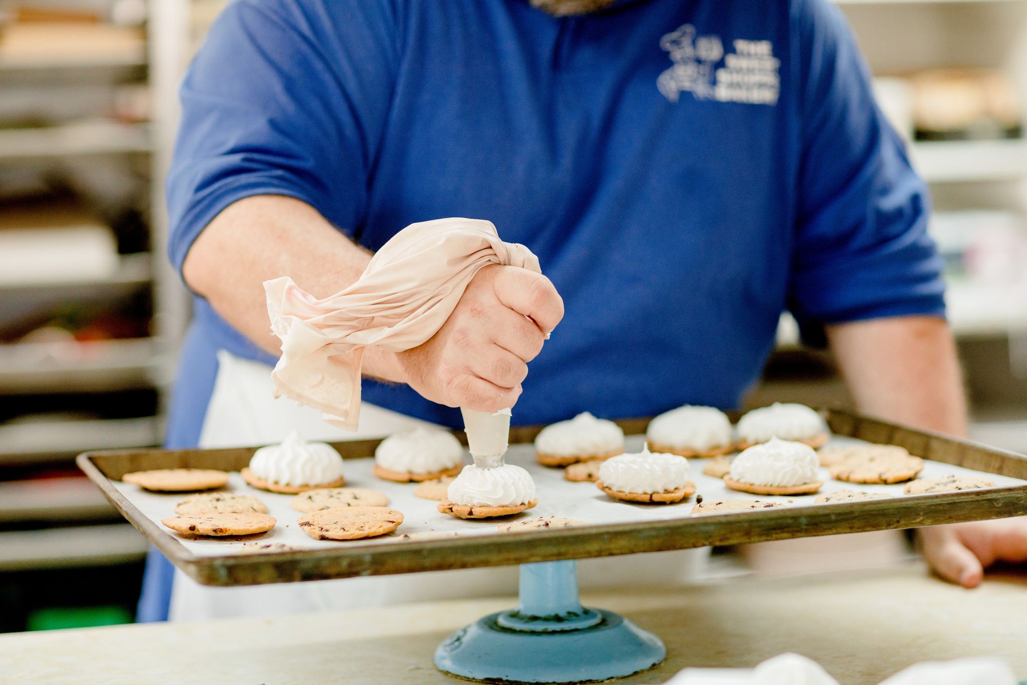Ken Cagle Jr. decorates cookies at Sweet Shoppe Bakery in High Point, NC.