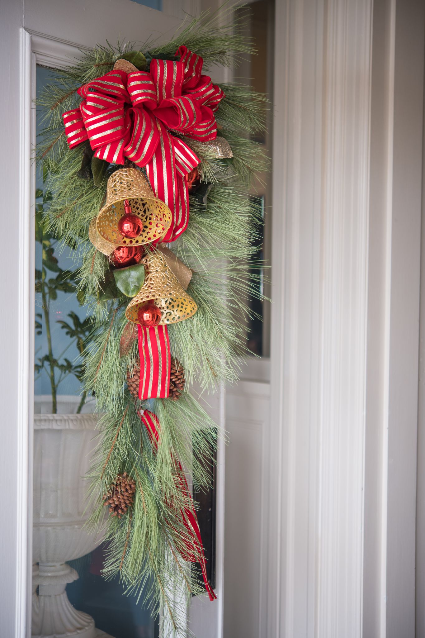 A wreath and bow hang on a door of a home in High Point, NC.