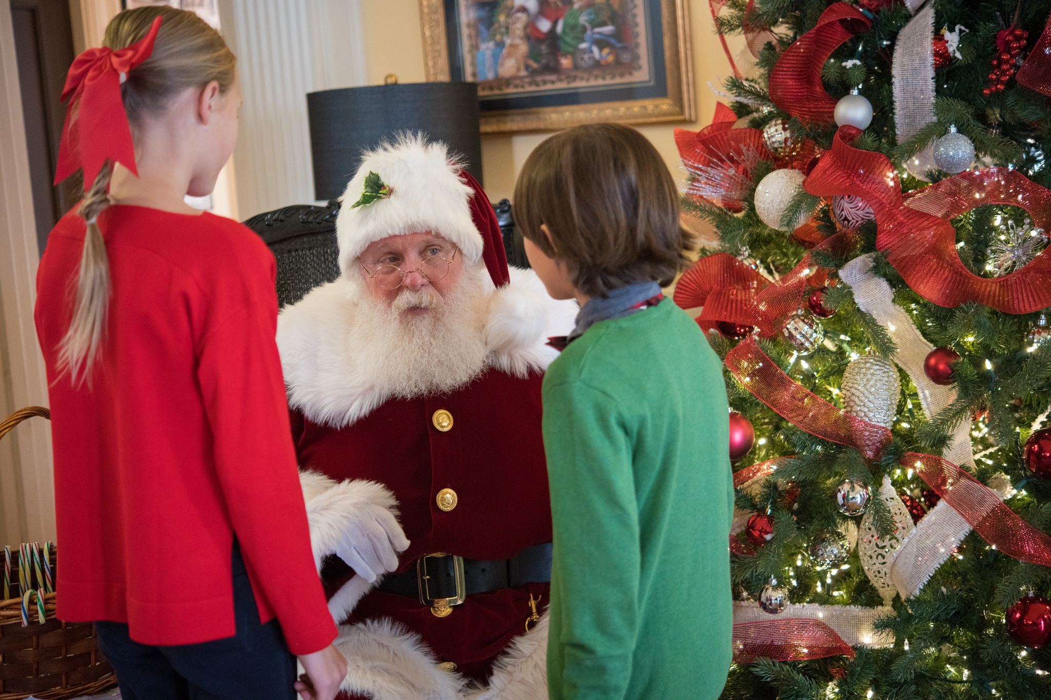 Children speaking to Santa at the Uptowne Holiday Stroll in Uptowne High Point, NC at the JH Adams Inn.