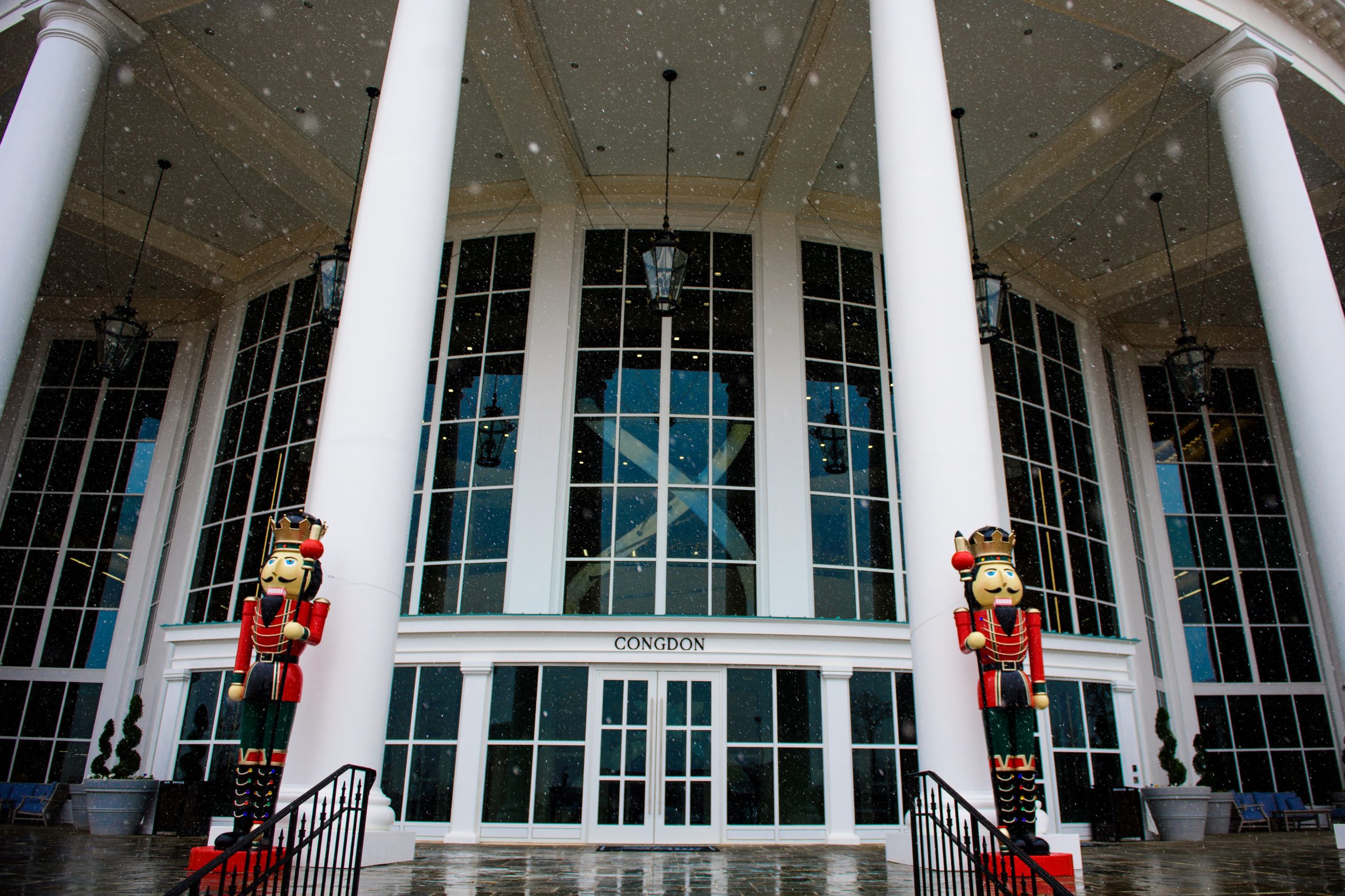 Christmas nutcrackers stand in front of Congdon Hall at High Point University.