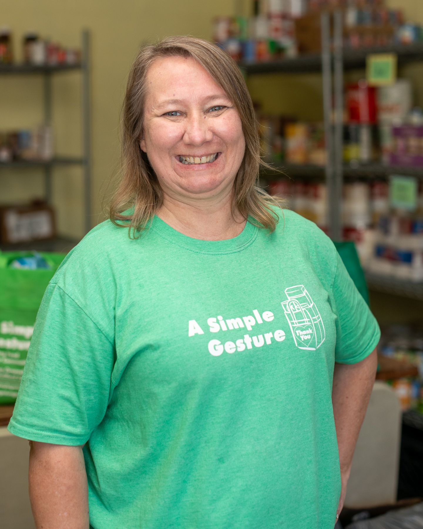 Karen Brudnak - Outreach Coordinator for High Point stands in the West End Ministries food pantry.