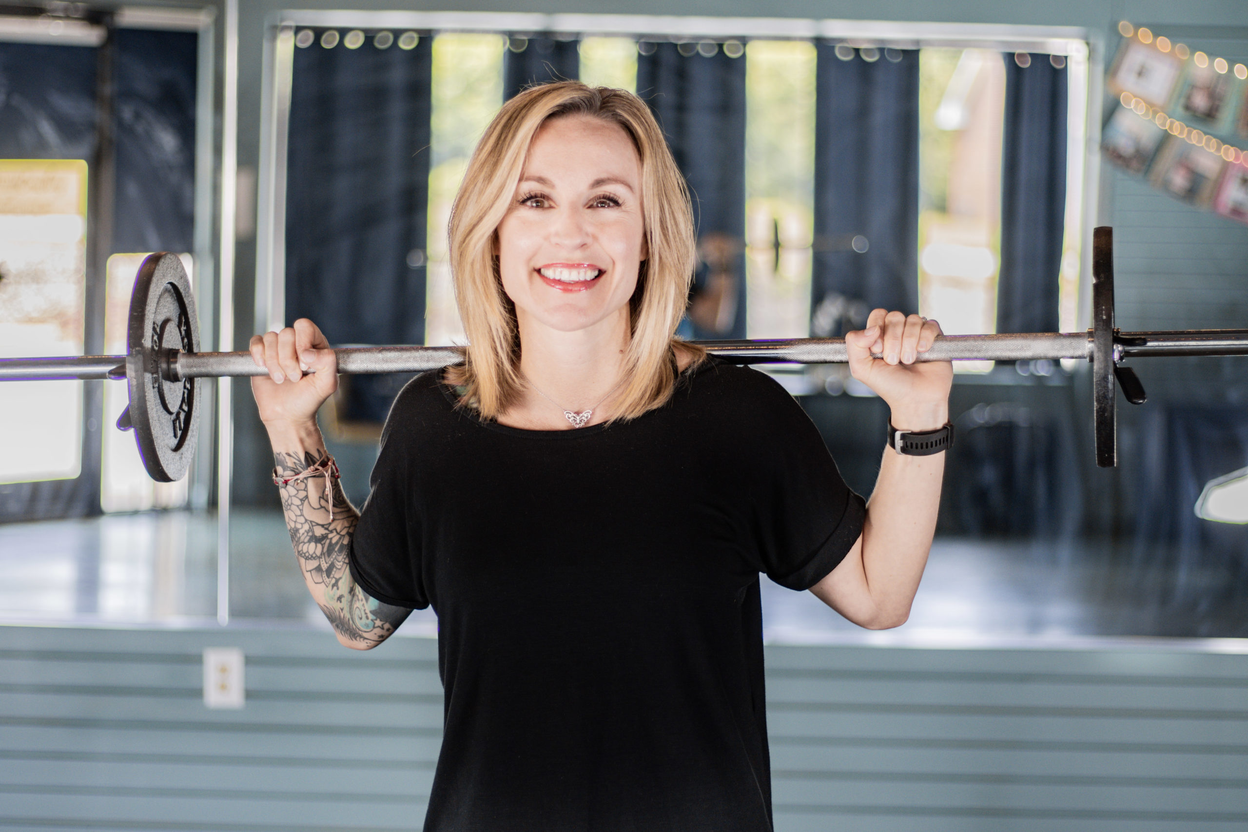 Deborah Stanton with weights in MovingRoom Coaching studio
