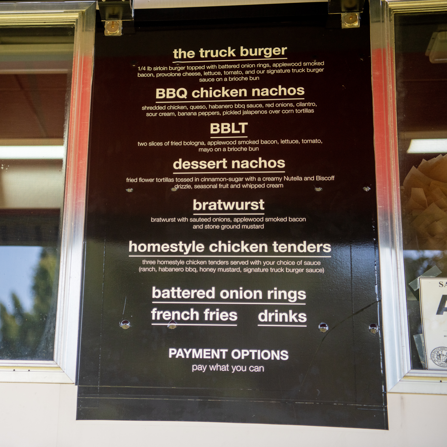 The Hope Truck Food Co. menu at the food truck lists items like the Truck Burger and BBQ Chicken Nachos.