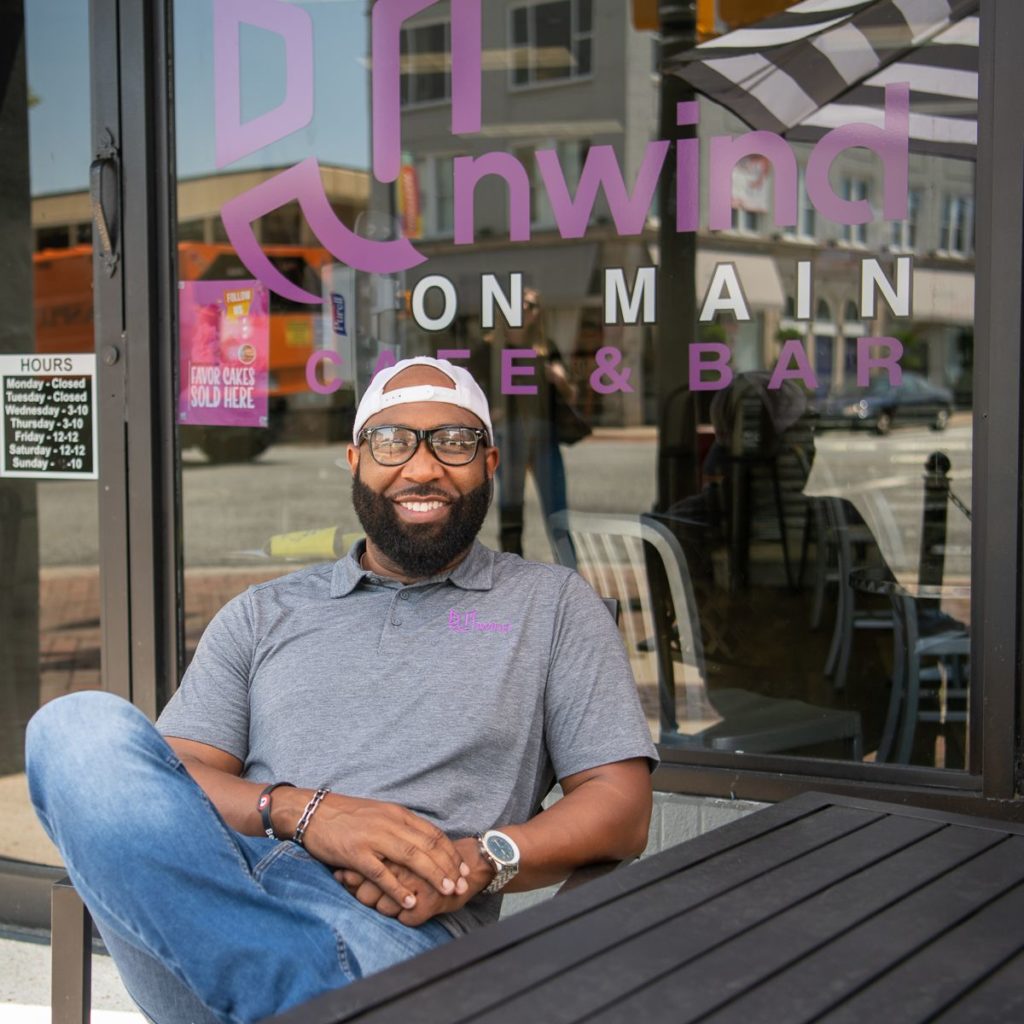 Anthony Anderson sits outside of Unwind on Main Cafe & bar in High Point, NC