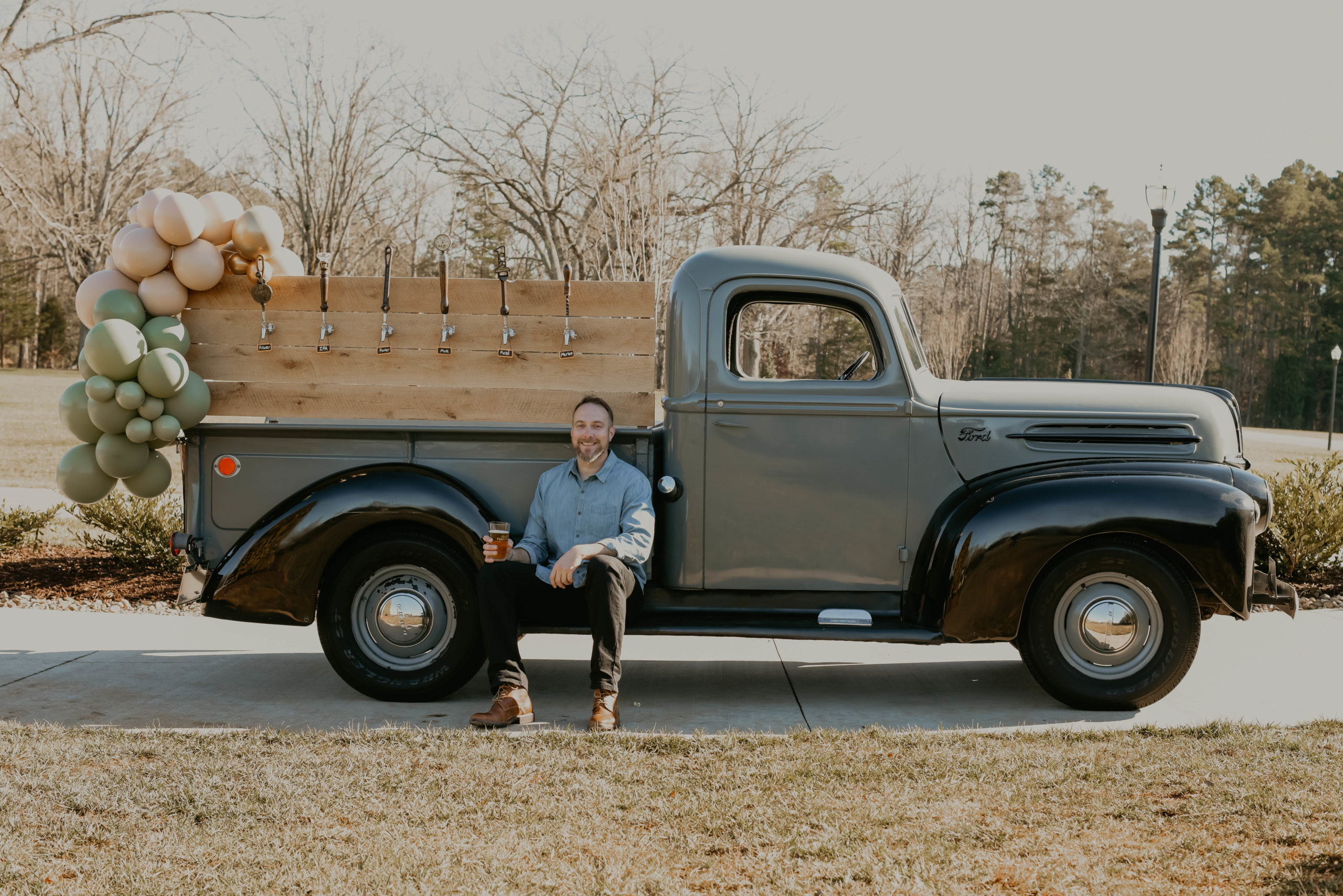 Will Combs, owner of Proper Pour Events sits on his Ford truck that doubles as a tap system.