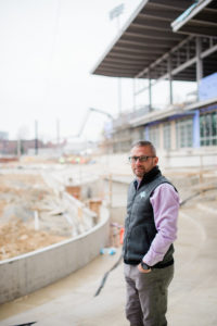 Jamie Keefe, team manager stands proudly at the construction of Trusit Point in High Point, NC