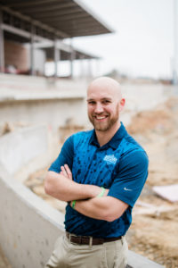 Christian Heimall stands proudly at the construction of Trusit Point in High Point, NC