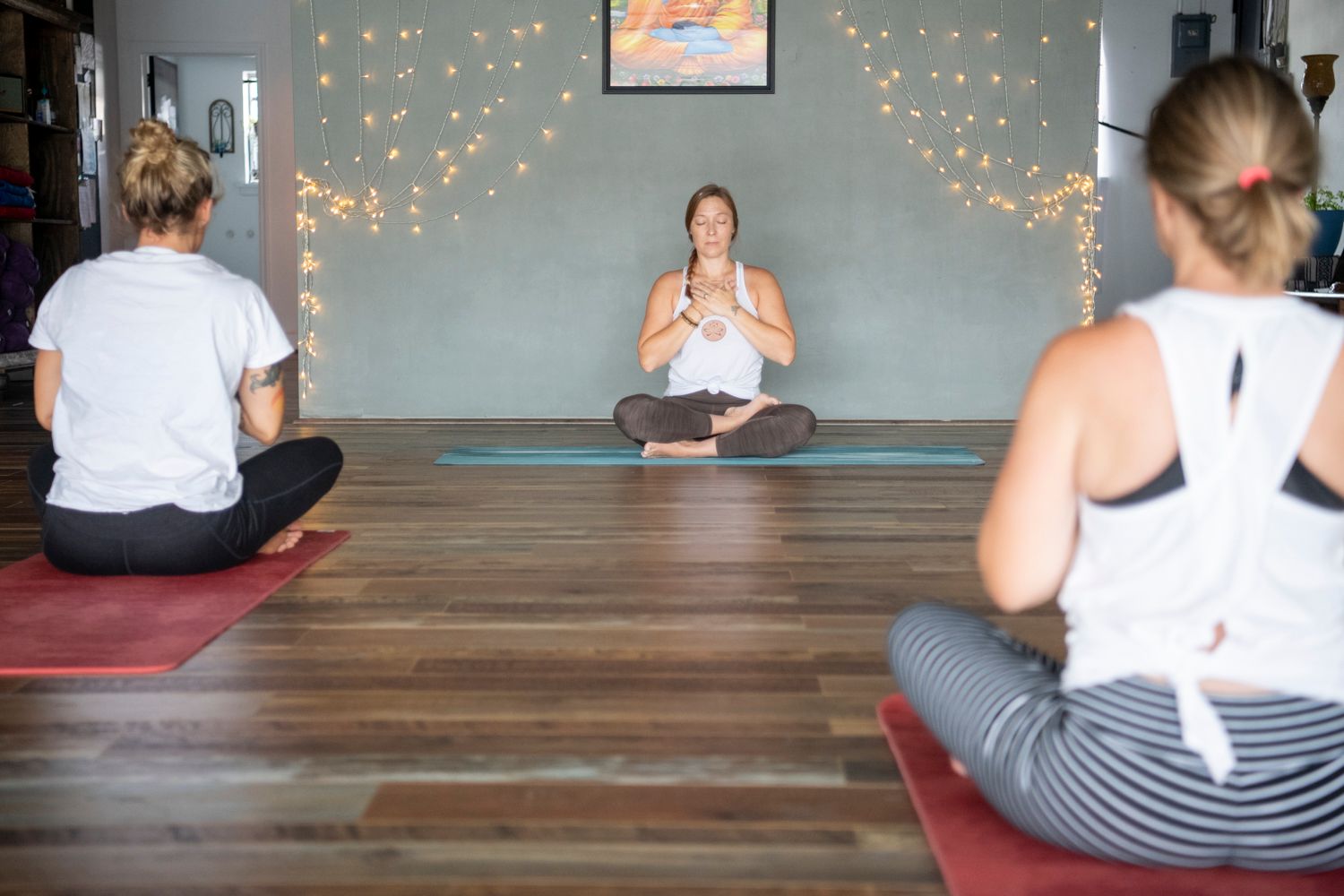 High Point Yoga School owner and instructor Jenn Newton leads a group meditation in her High Point, NC yoga studio.