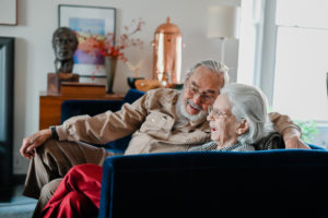 Bert and Shirley Rau sit on the couch in High Point, NC