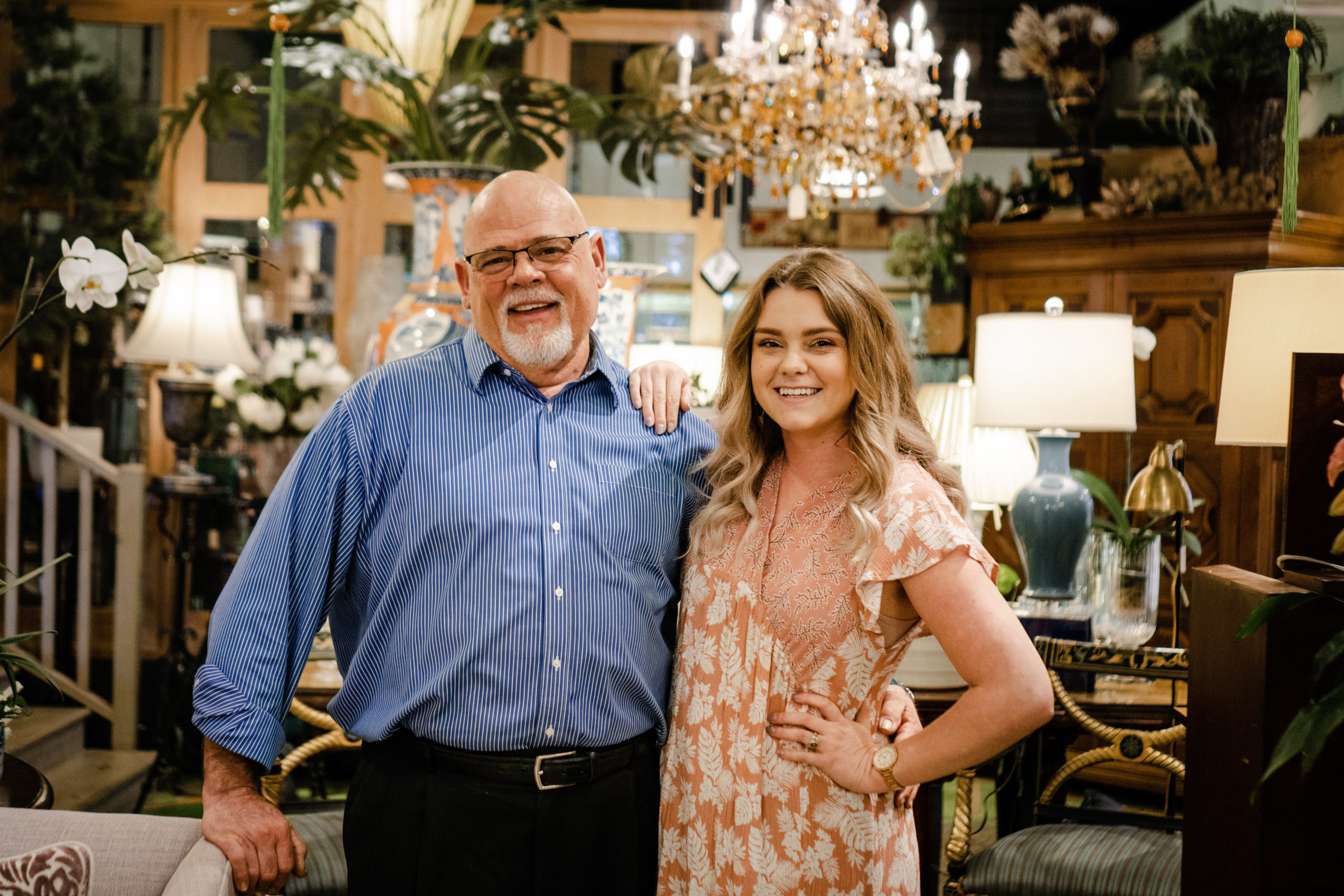High Point florist, John Paulin stands in his floral shop and gift shop, Grassy Knoll with his assistant, Lauren Carson in High Point, NC.