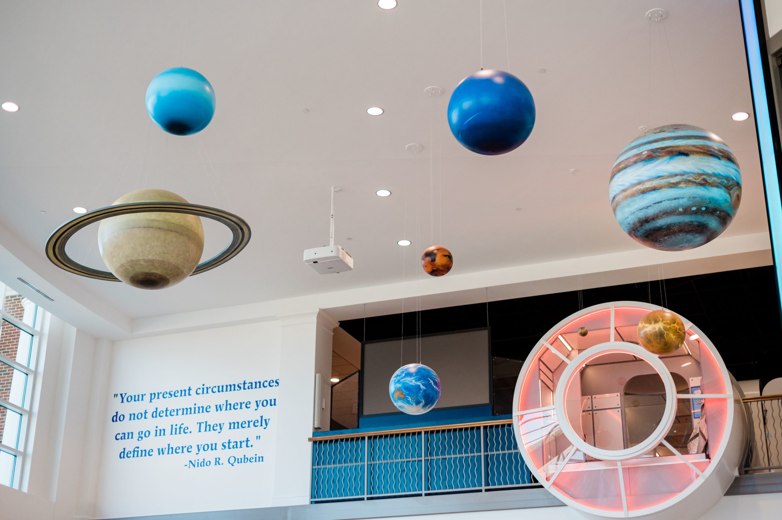 The Gallery at the Nido & Mariana Qubein Children's Museum in High Point has a quote from Dr. Nido Qubein and hanging planets.