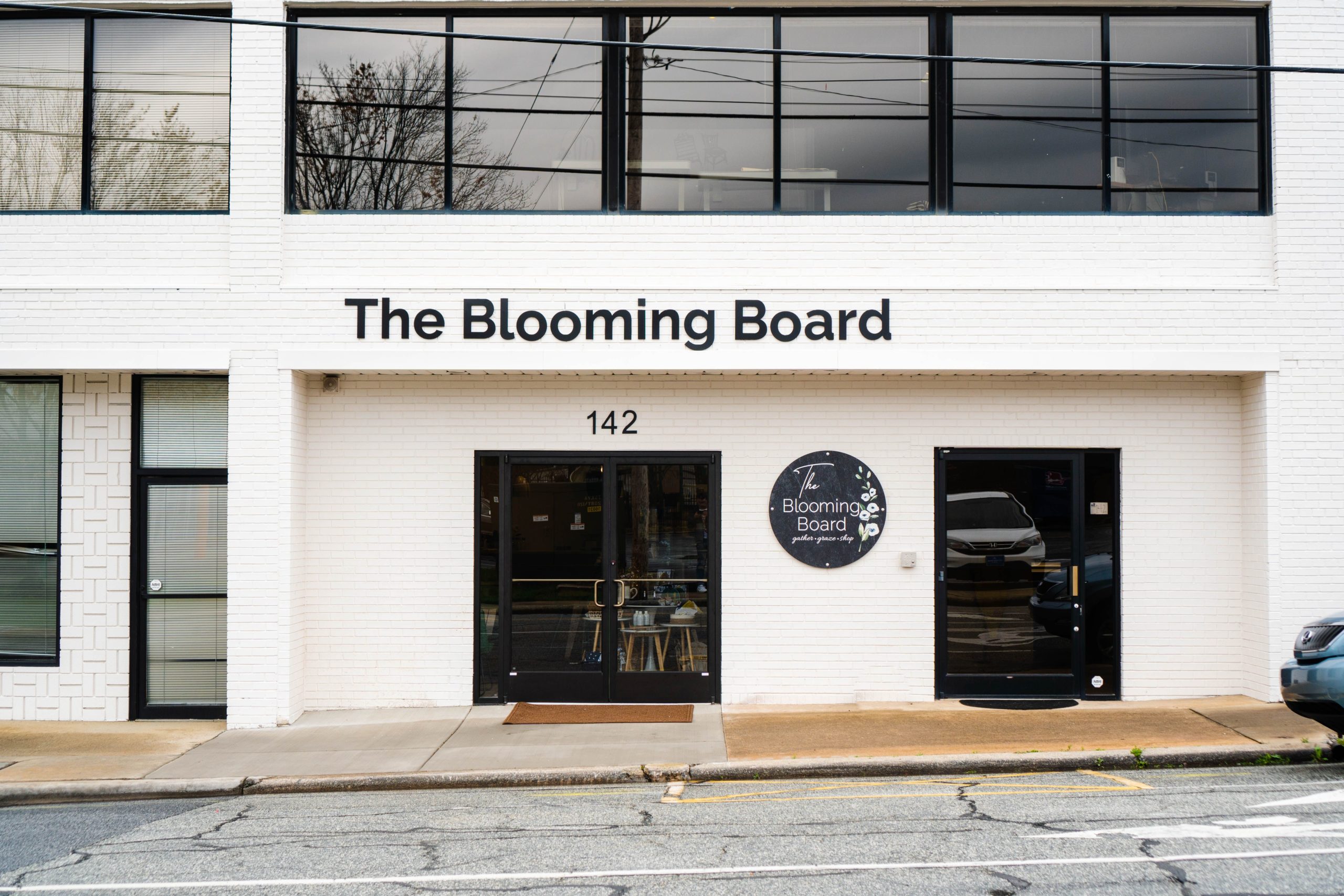 The storefront of The Blooming Board, a new characuterie shop and boutique in downtown High Point, NC.