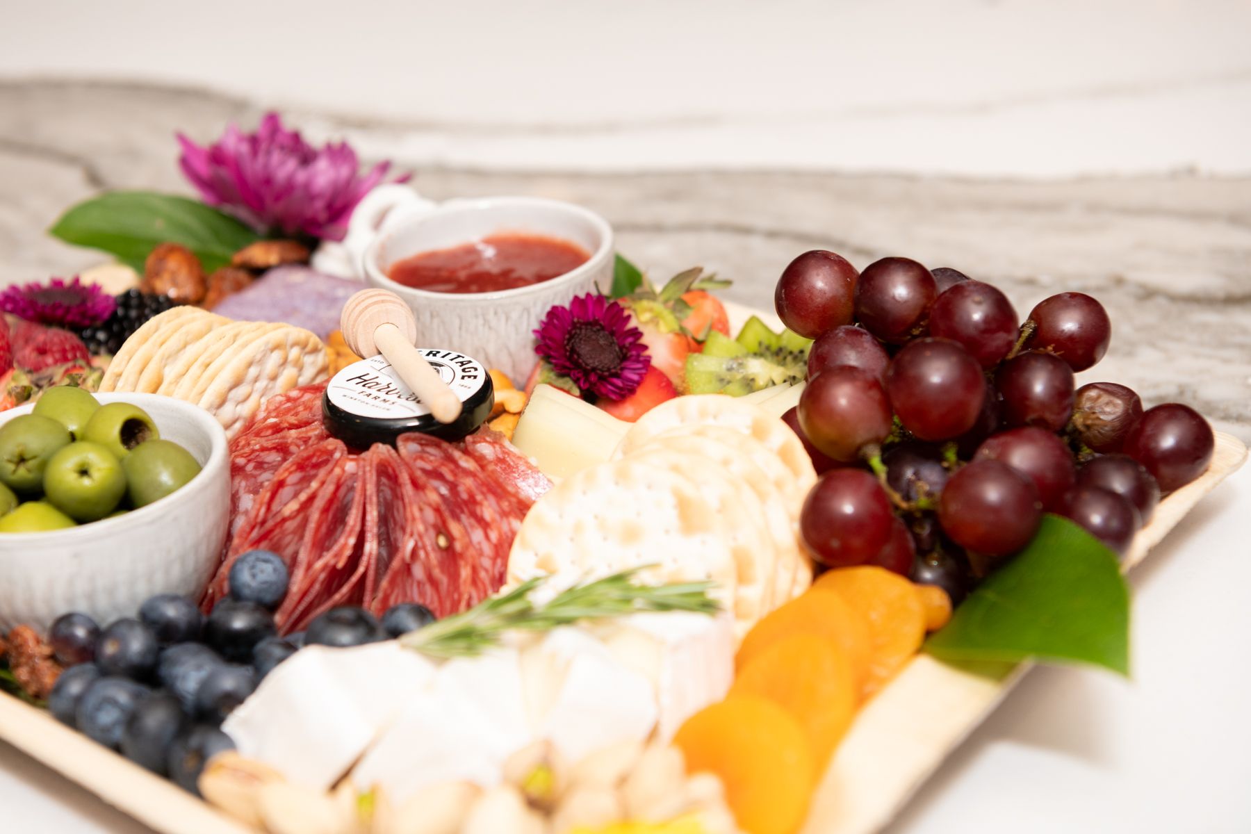 A charcuterie board designed by the Blooming Board.