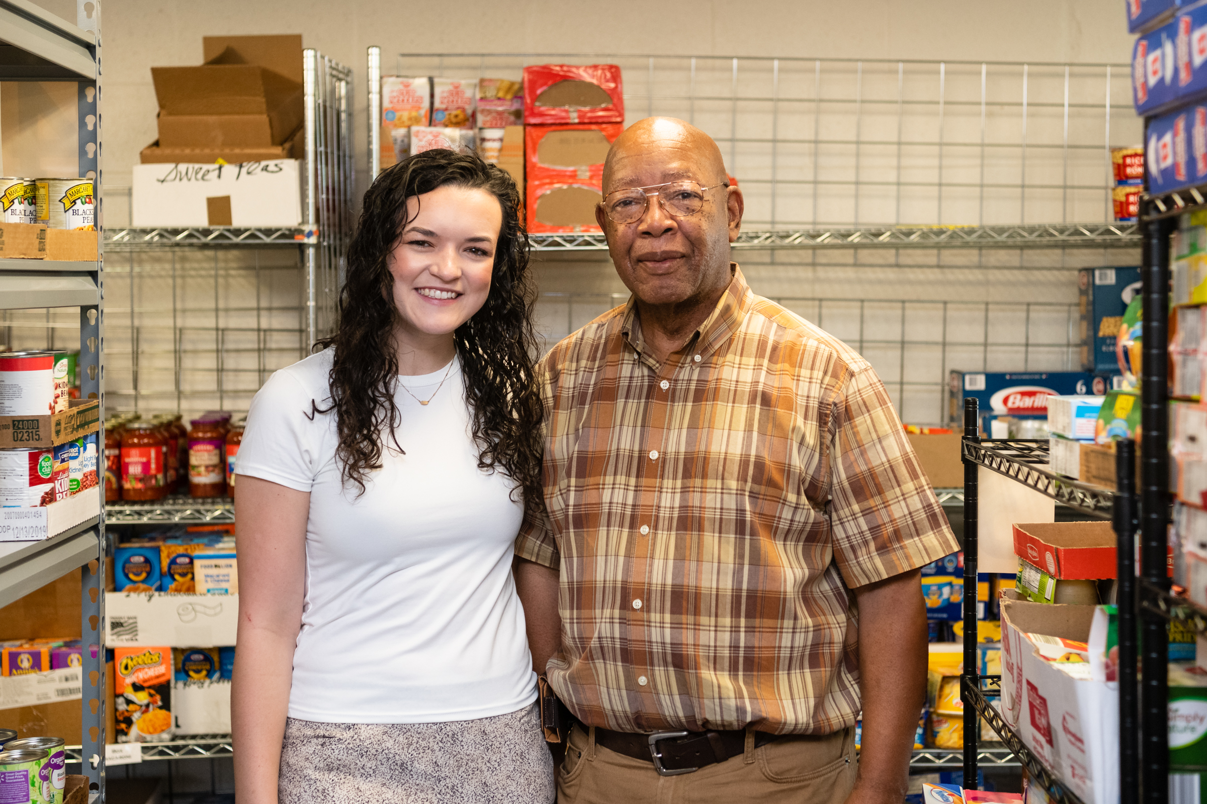 HPU Vista, Gabby Kozlowski stands with Jerry Mingo at the food pantry in High Point, NC.