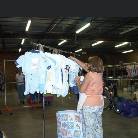 Deane organizing clothes in one of the temporary WeeRuns' warehouse in 2010.