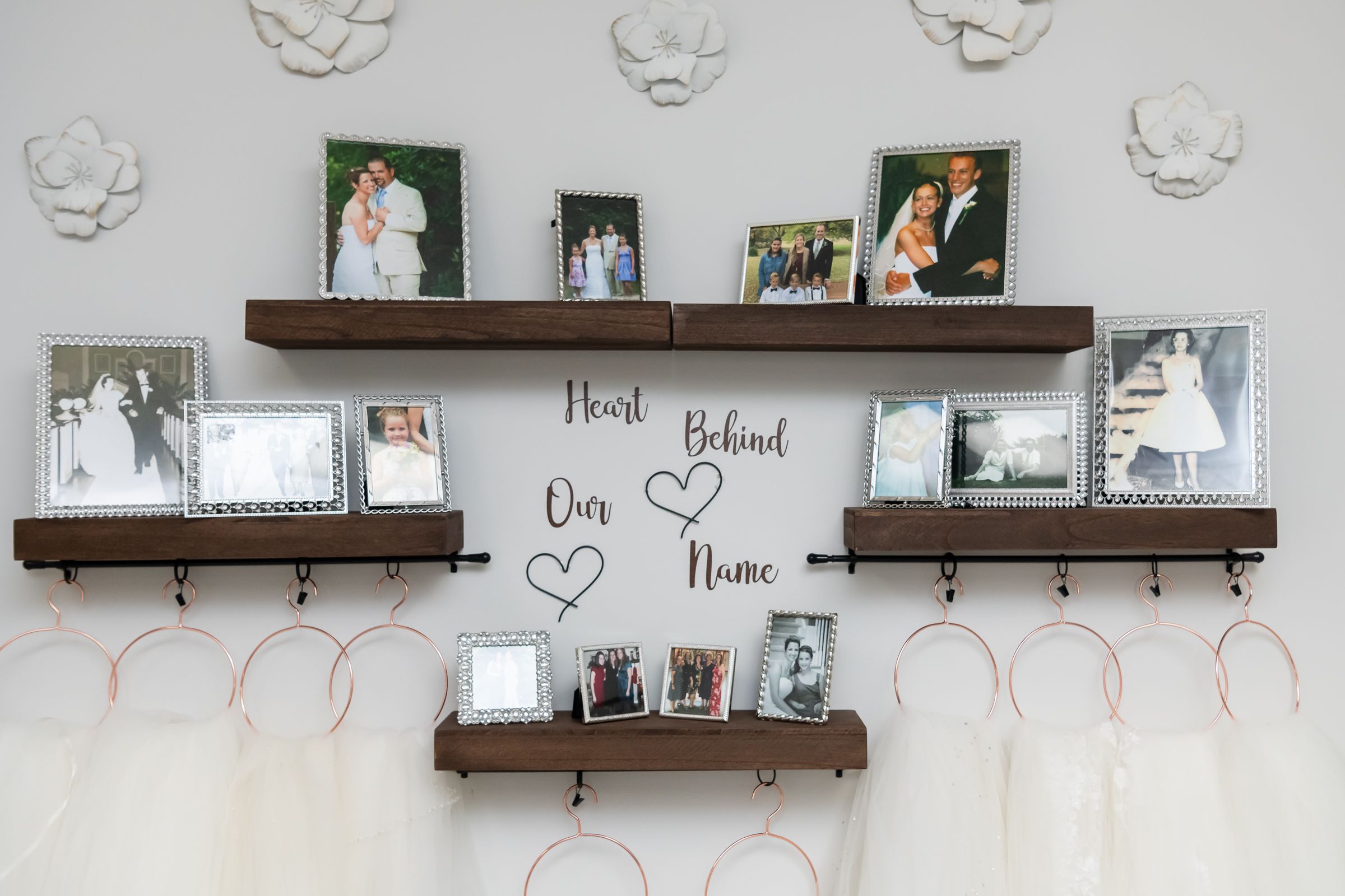 A wall of photos showing generations of weddings and love in the owners' lives.