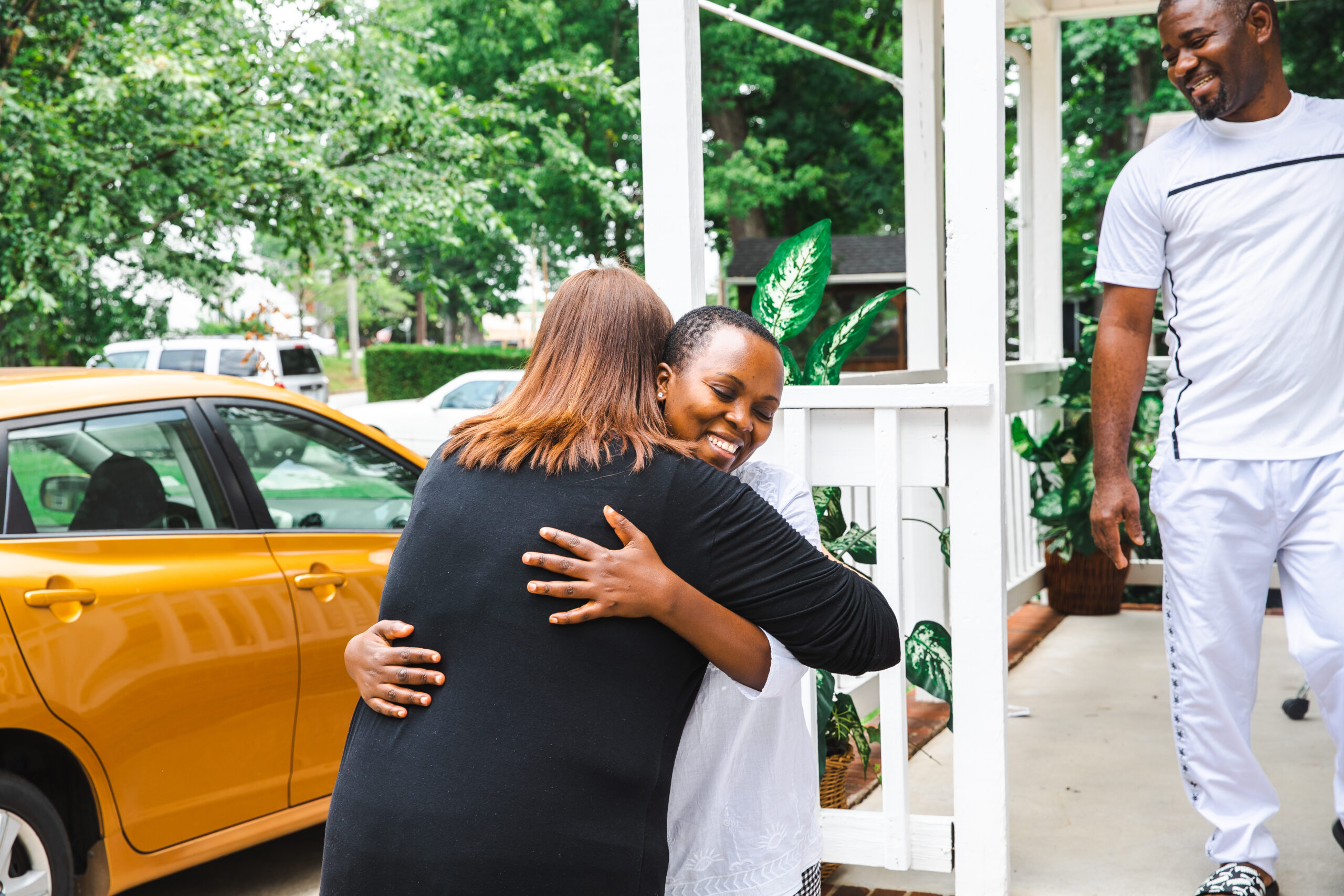 Post-Arrival Reception & Placement Program Officer at the World Relief, Kara Hernandez hugs Didi Lwamba, a client World Relief resettled from the Democratic Republic of the Congo.