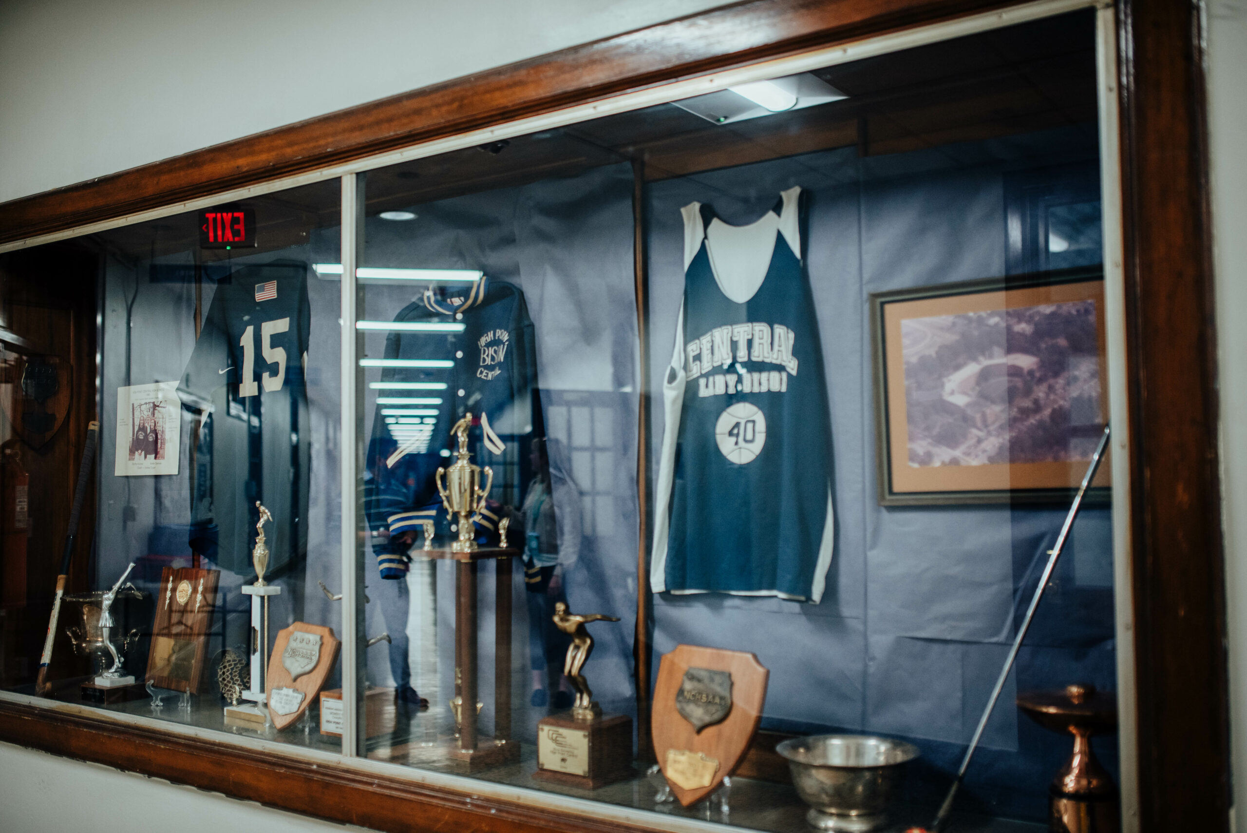 Old jerseys and awards at HP Central hang in the hallways.