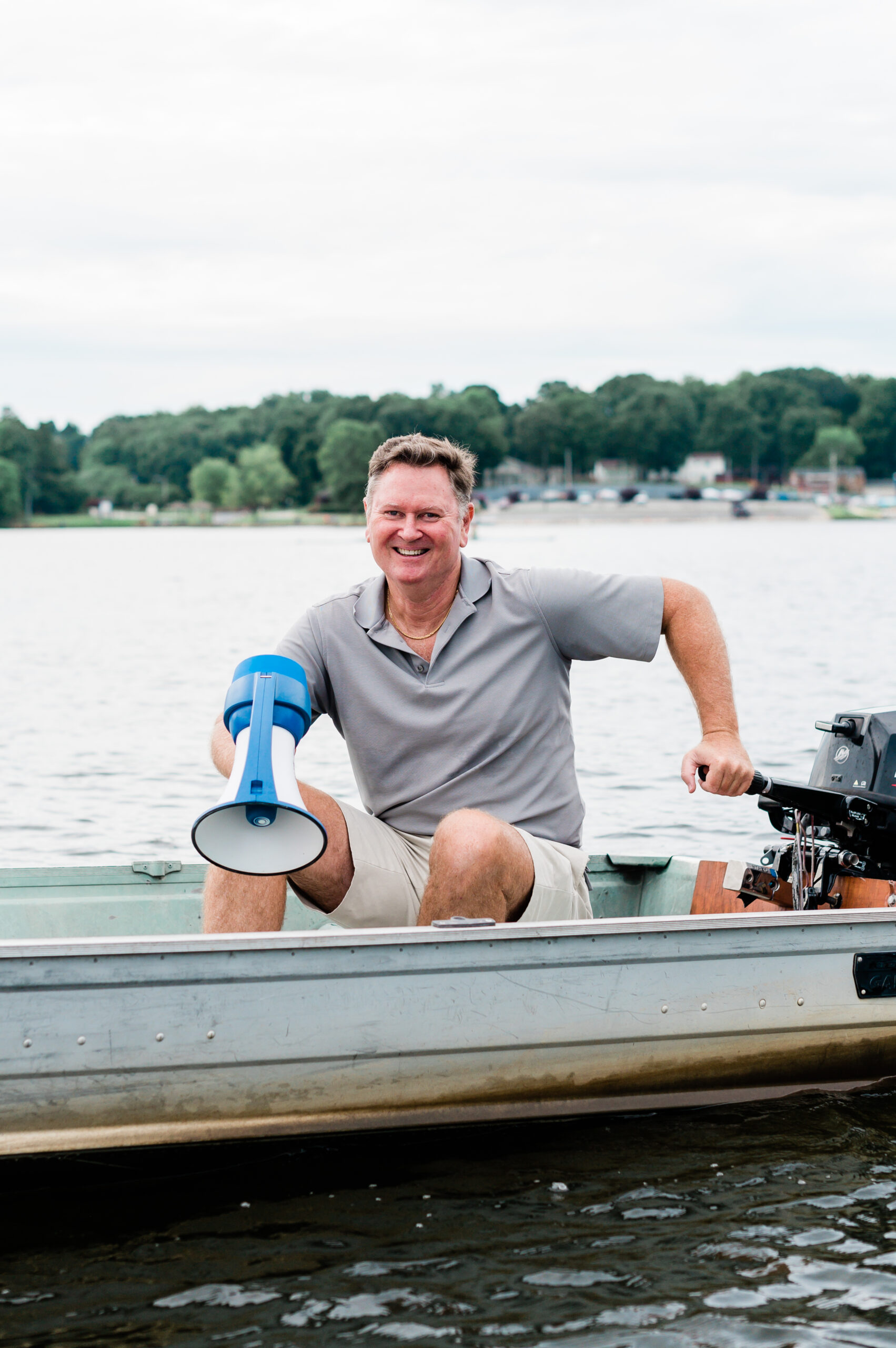 Gene Kininmonth, Founder of Triad United Rowing, sits in a boat on Oak Hollow Lake in High Point, NC.