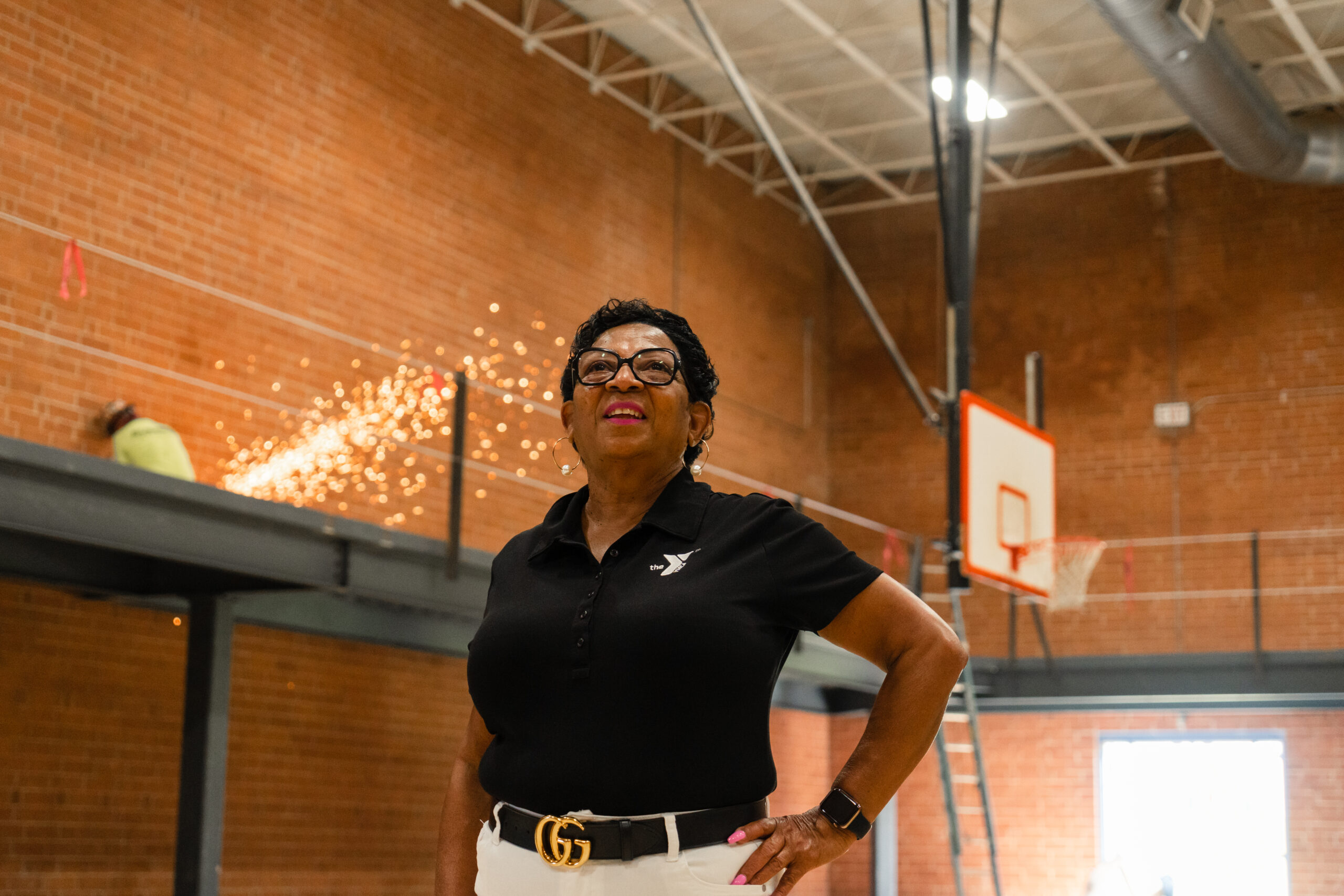 Carlvena Foster stands in the Chavis YMCA gymnasiusm as it undergoes rennovations to better serve our community.