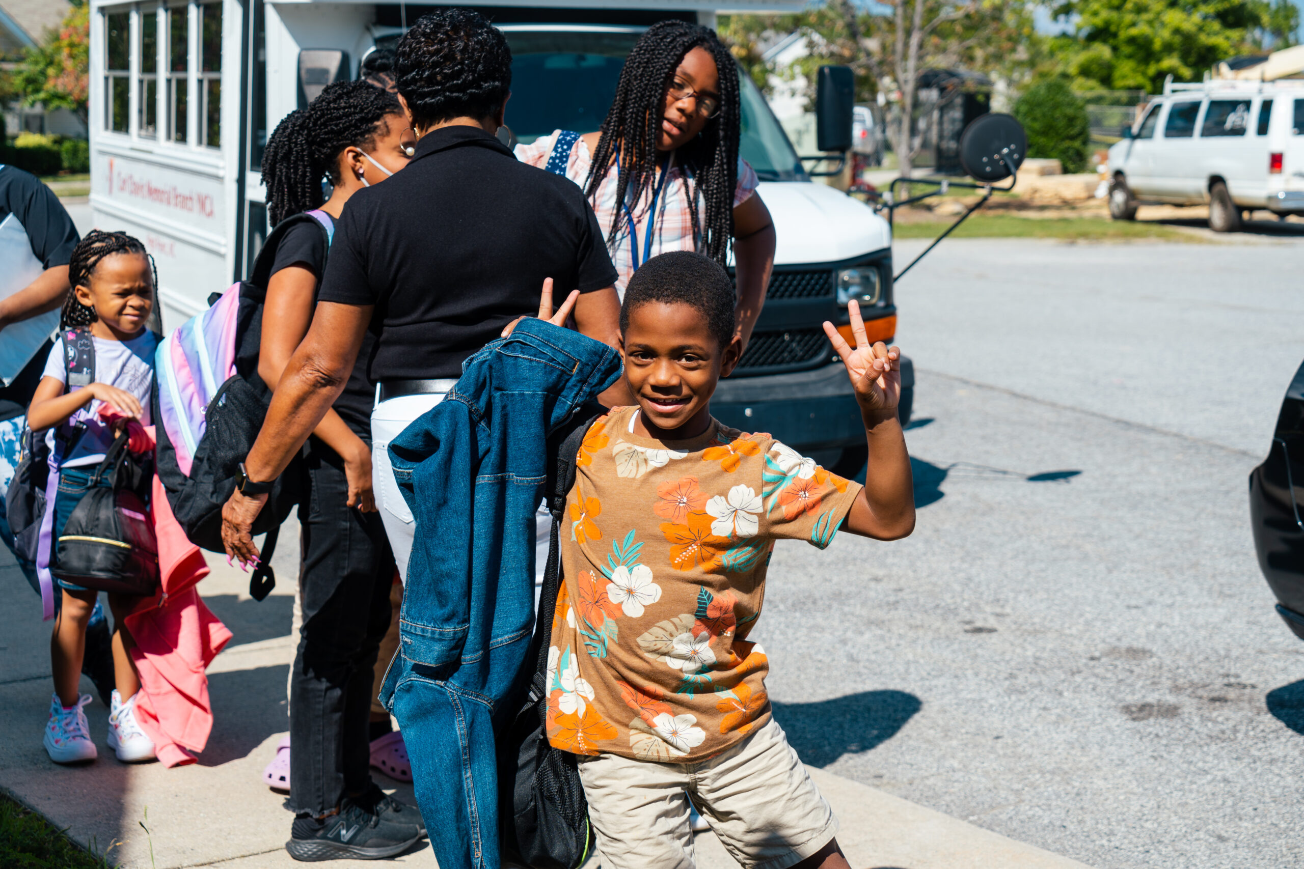 Students step off the bus at the Carl Chavis YMCA in High Point.