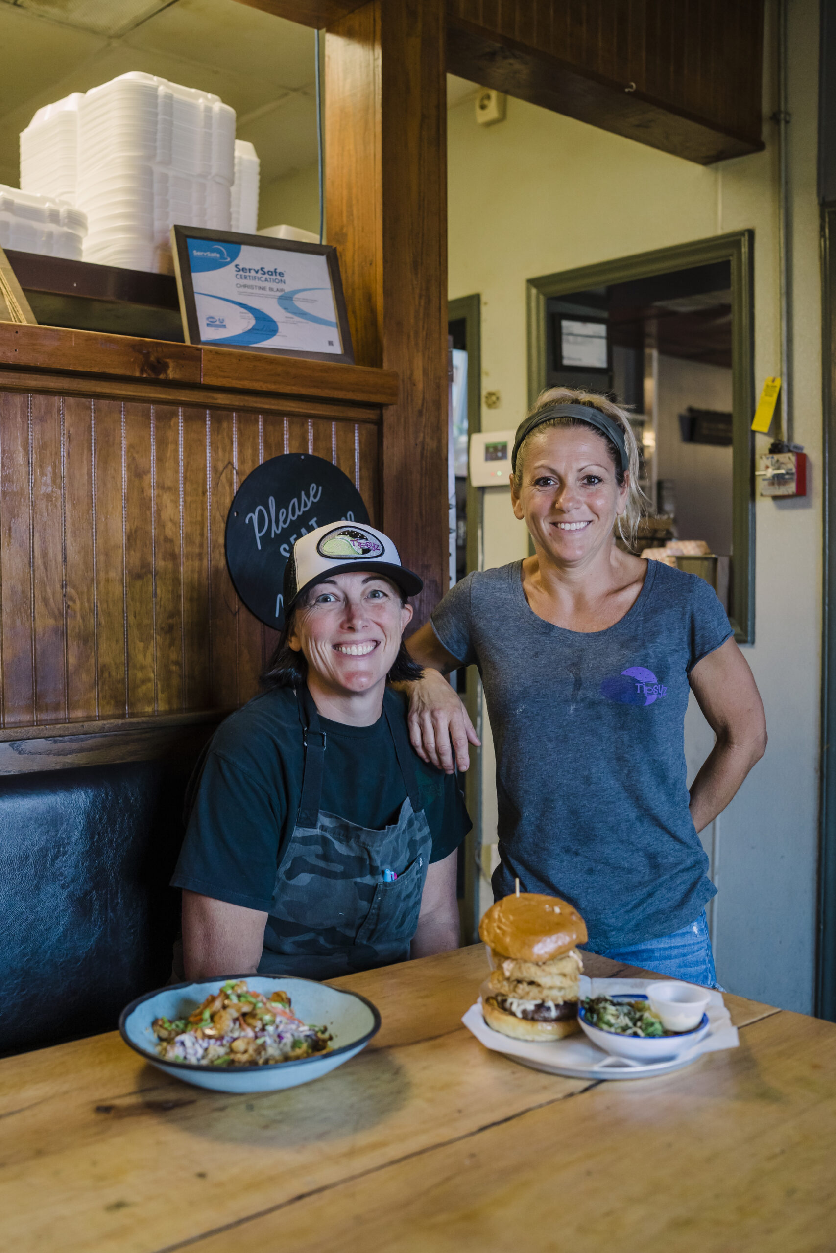 Christine and Holly Blair, Owners of Tipsy'z Tavern sit inside their restaurant in High Point.