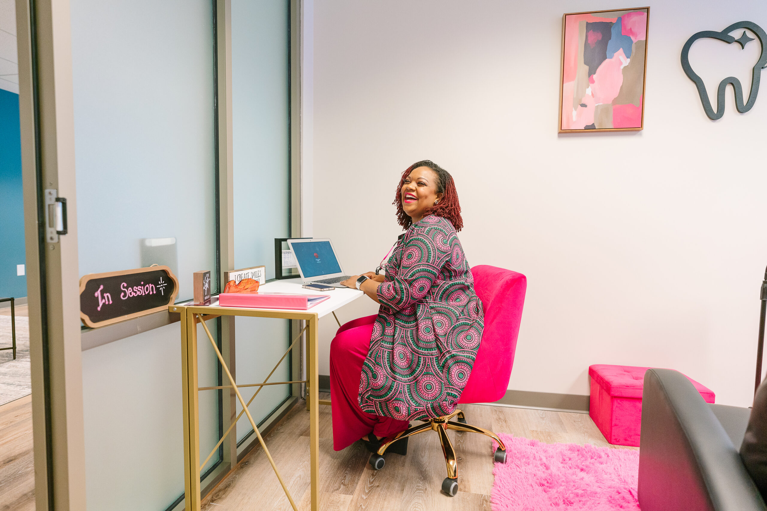 Chimere Collins working in her office at Agape Smiles.